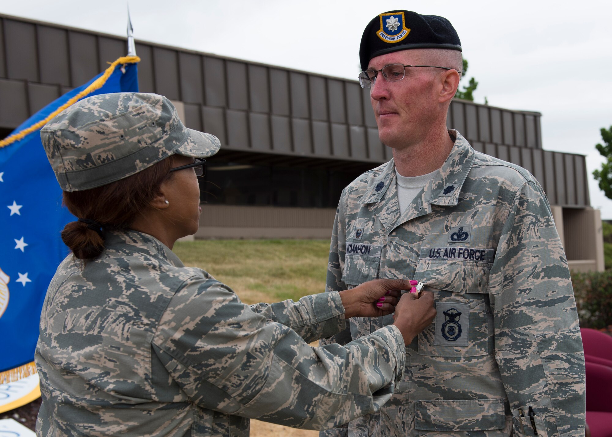 Col. Yvonne Spencer, 92nd Mission Support Group commander, pins a Meritorious Service Medal, 2nd Oak Leaf Cluster, to the uniform of Lt. Col. Kevin McMahon during the 92nd Security Forces Squadron change of command ceremony June 8, 2017, at Fairchild Air Force, Washington. McMahon led his team of defenders to assist Fairchild AFB in being awarded the Omaha Trophy Award and his leadership allowed the 92nd SFS to earn the distinction of Air Force's Best Small Security Forces Squadron Award.
(U.S. Air Force Photo / Airman 1st Class Ryan Lackey)