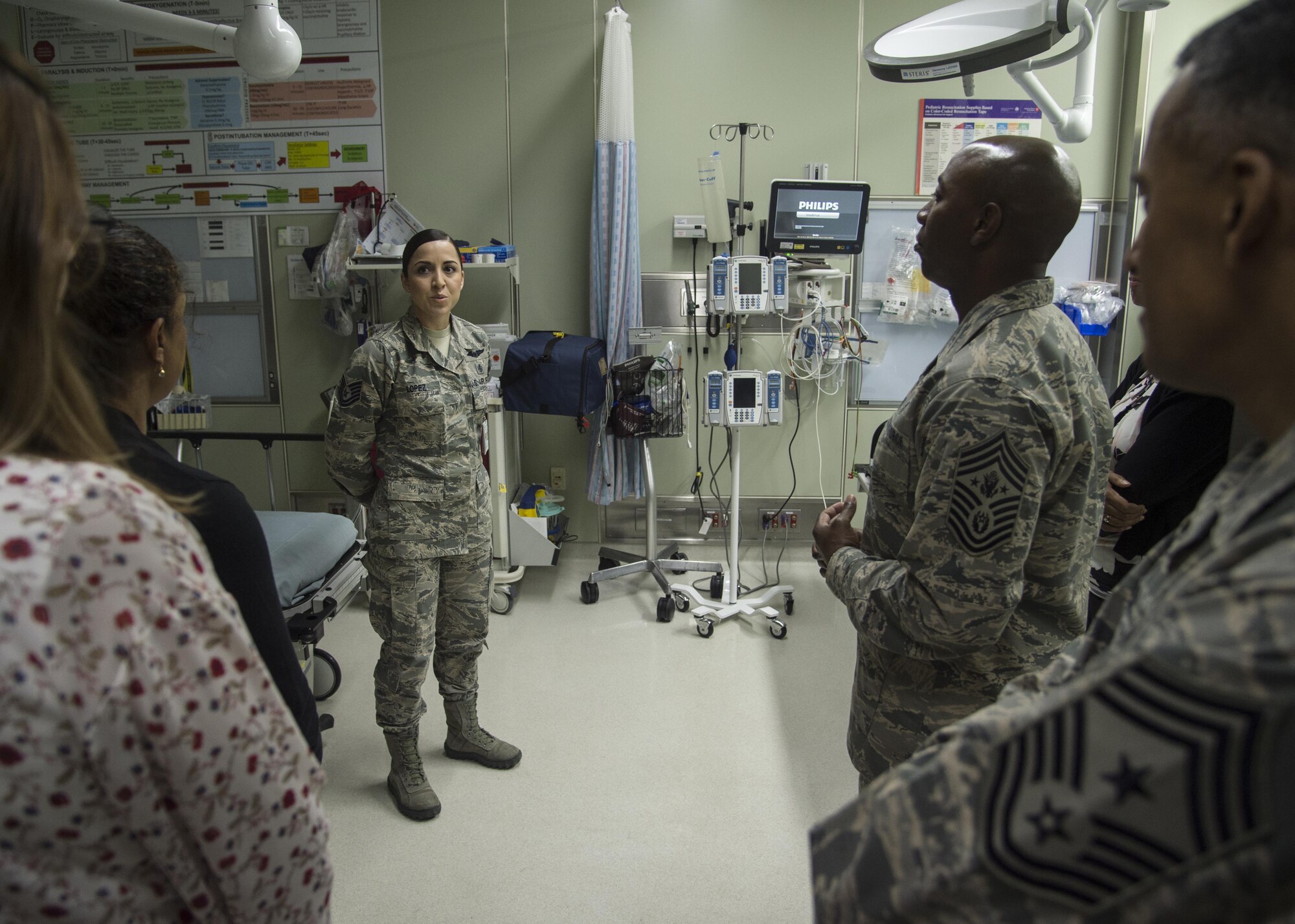 Chief Master Sgt. of the Air Force Kaleth O. Wright listens to a 35th Medical Group brief given by Tech. Sgt. Sarah Lopez, 35th Medical Operations Squadron unit care center chief, during his Pacific Air Forces’ immersion tour at Misawa Air Base, Japan, June 9, 2017. During his visit, Wright spoke with 35th Fighter Wing Airmen, addressing their concerns and critical roles within Pacific Air Forces. Wright also dedicated time mentoring junior and senior enlisted Airmen. (U.S. Air Force photo by Senior Airman Deana Heitzman)
