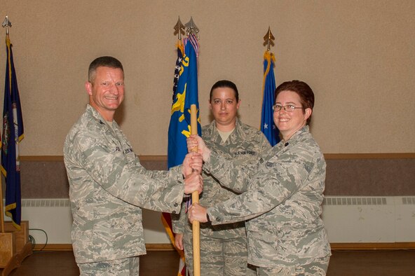 U.S. Air Force Col. William Fecke, the 354th Medical Group commander, passes the 354th Medical Operations Squadron (MDOS) guidon to Lt. Col. Valerie O’Brien, the new 354th MDOS commander, June 8, 2017, at Eielson Air Force Base, Alaska. O’Brien took command from Col. Mark Anderson, who will go on to serve as the 55th MDOS commander at Offutt Air Force Base, Nebraska. (U.S. Air Force photo by Airman 1st Class Isaac Johnson)