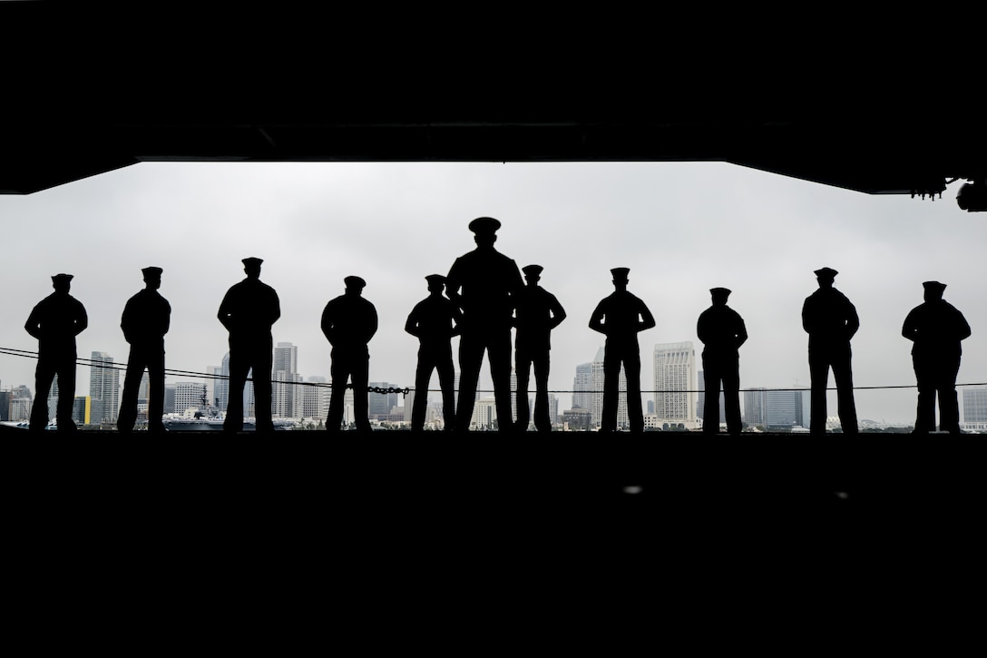 Sailors man the rails aboard the aircraft carrier USS Nimitz in San Diego, June 5, 2017. The Nimitz Carrier Strike Group departed for a regularly scheduled deployment. Navy photo by Petty Officer 2nd Class Holly L. Herline