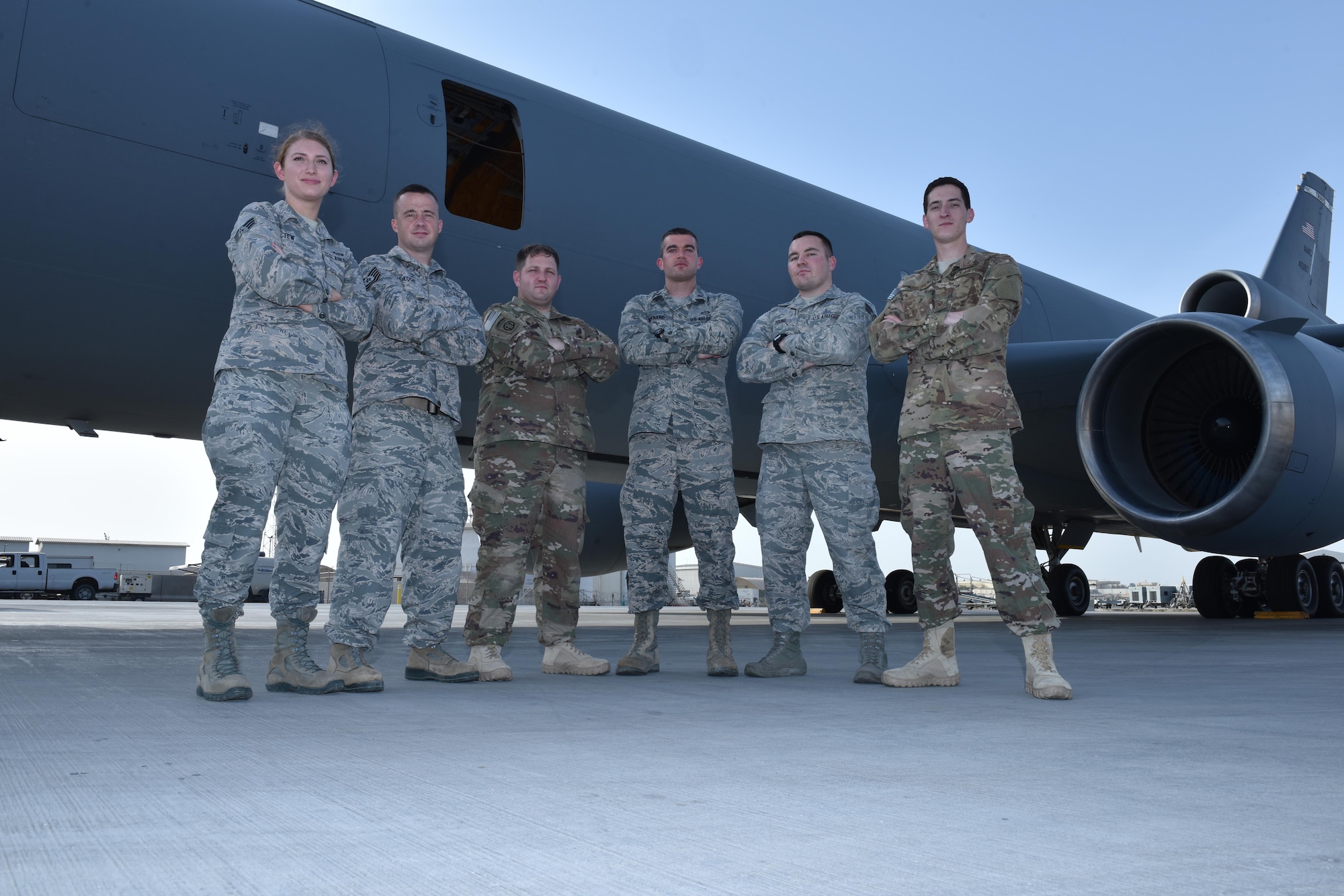 Airmen of the 380th Expeditionary Operations Support Squadron weather flight stand in front of a KC-10 Extender at an undisclosed location in southwest Asia, June 5, 2017. Forecasters play a critical role in mission planning to ensure that Airmen accomplish the mission effectively and safely. (U.S. Air Force photo by Staff Sgt. Marjorie A. Bowlden)
