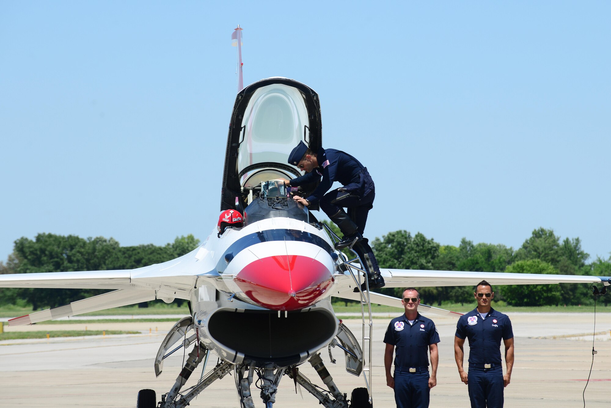 Lt. Col. Jason Heard, U.S. Air Force Air Demonstration pilot, gets into an F-16 during a pre-demonstration ground show at Scott Air Force Base June 9, 2017. Prior to joining the Thunderbirds, he led an F-15E squadron in combat as an expeditionary squadron commander. He has logged more than 3,000 flight hours with 788 hours of combat experience.  The Thunderbirds were headlining act of the base’s Centennial Air Show.   (U.S. Air Force photo by Tech. Sgt. Maria Castle)