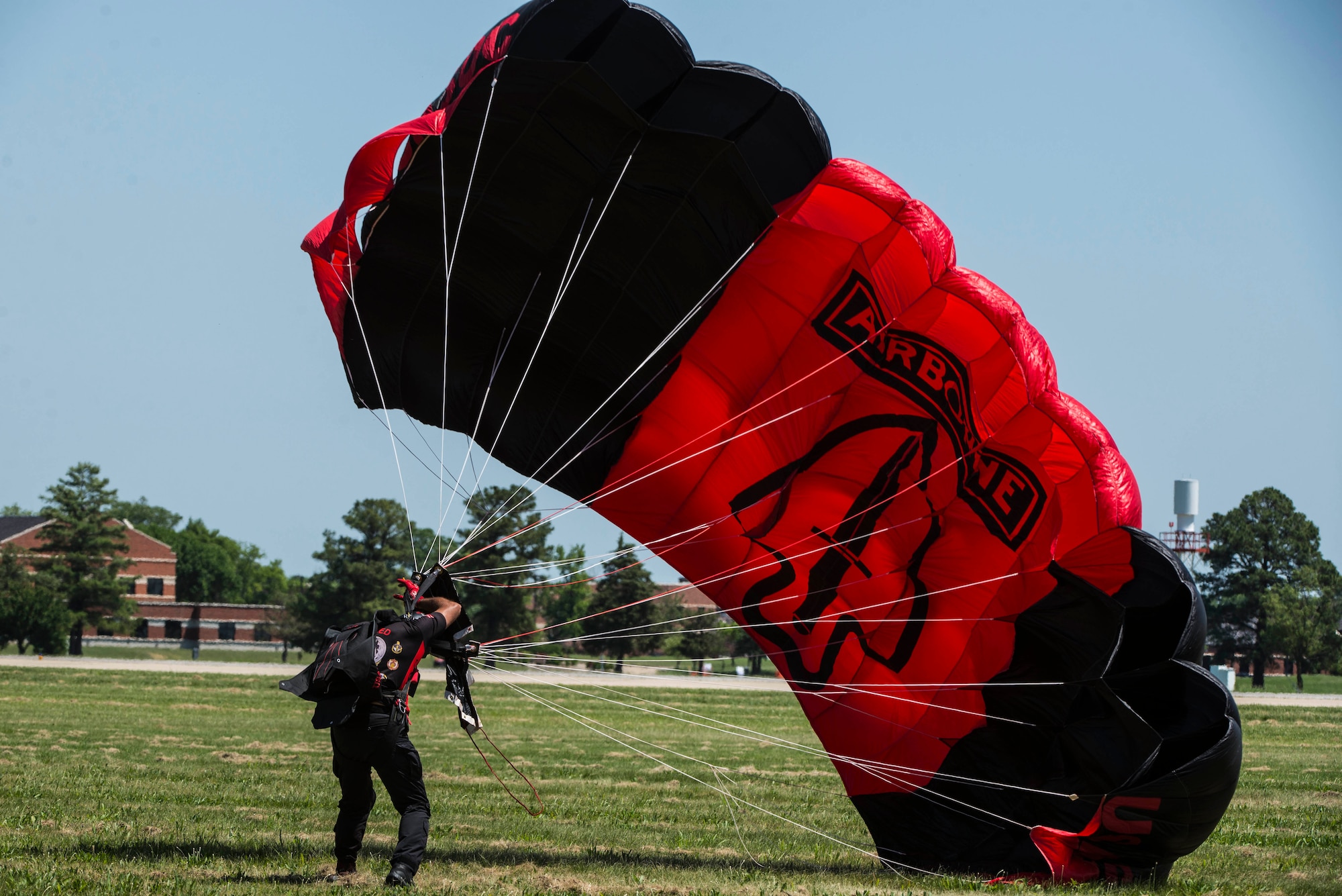 Members of the Black Daggers, the official U.S. Army Special Operations Command Parachute Demonstration Team, perform aerial stunts during Scott Air Force Base 2017 Air Show and Open House June 9, which celebrates the base’s 100th anniversary.  The black daggers use the military variant of the ram-air parachute, which is a flexible-wing glider.  This allows a free-fall parachutist the ability to jump with more than 100 pounds of additional equipment.(U.S. Air Force photo/Senior Airman Tristin English)