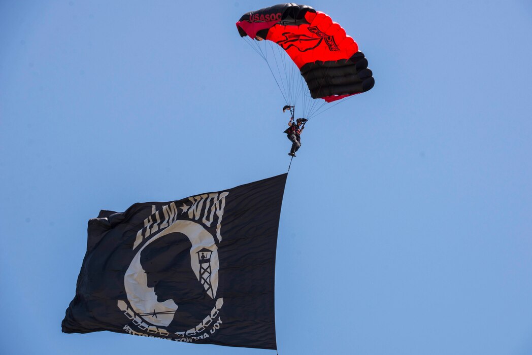 Members of the Black Daggers, the official U.S. Army Special Operations Command Parachute Demonstration Team, perform aerial stunts during Scott Air Force Base 2017 Air Show and Open House June 9, which celebrates the base’s 100th anniversary.  The black daggers use the military variant of the ram-air parachute, which is a flexible-wing glider.  This allows a free-fall parachutist the ability to jump with more than 100 pounds of additional equipment.(U.S. Air Force photo/Senior Airman Tristin English)