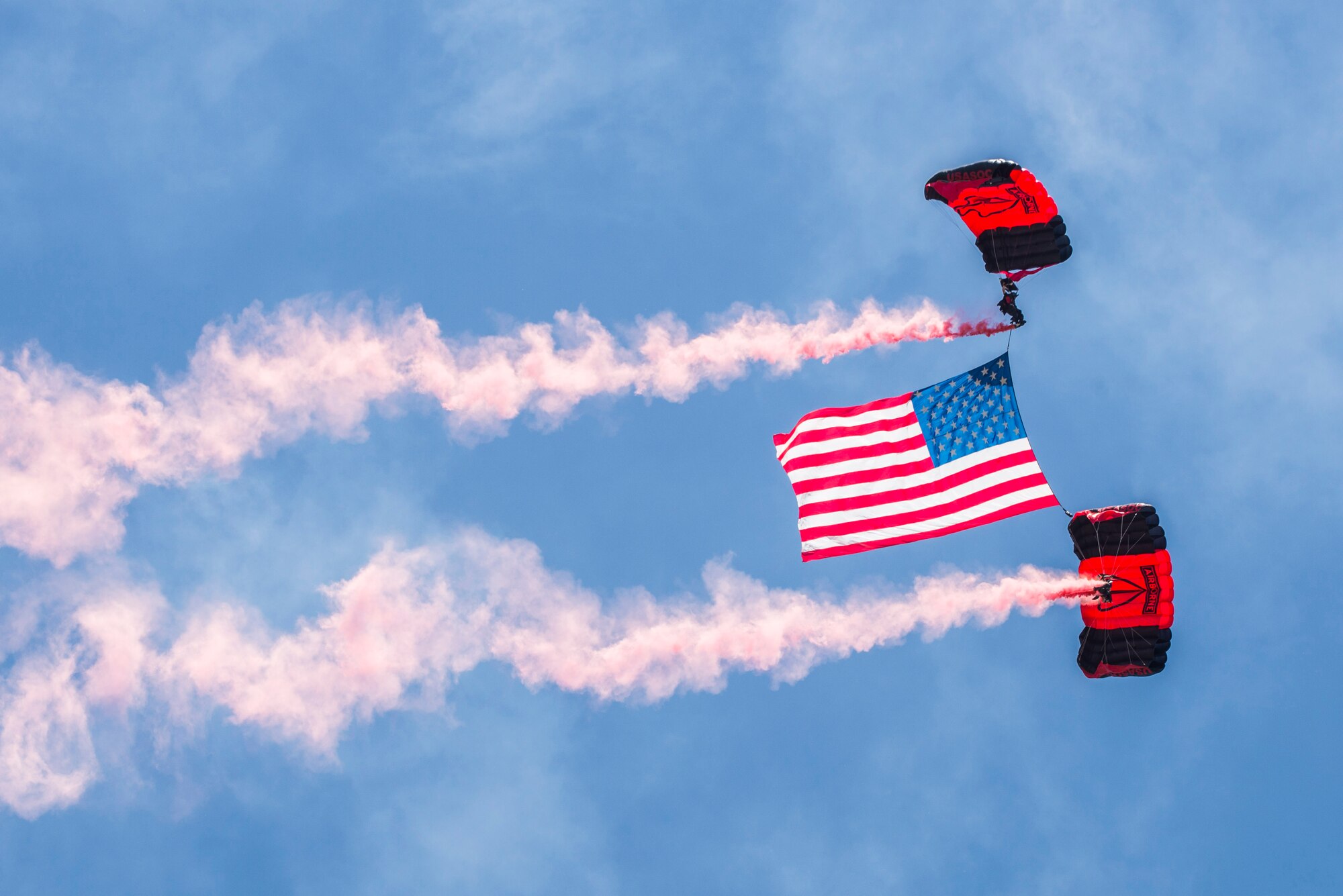 Members of the Black Daggers, the official U.S. Army Special Operations Command Parachute Demonstration Team, perform aerial stunts during Scott Air Force Base 2017 Air Show and Open House June 9, which celebrates the base’s 100th anniversary.  The black daggers use the military variant of the ram-air parachute, which is a flexible-wing glider.  This allows a free-fall parachutist the ability to jump with more than 100 pounds of additional equipment.(U.S. Air Force photo/Senior Airman Tristin English)