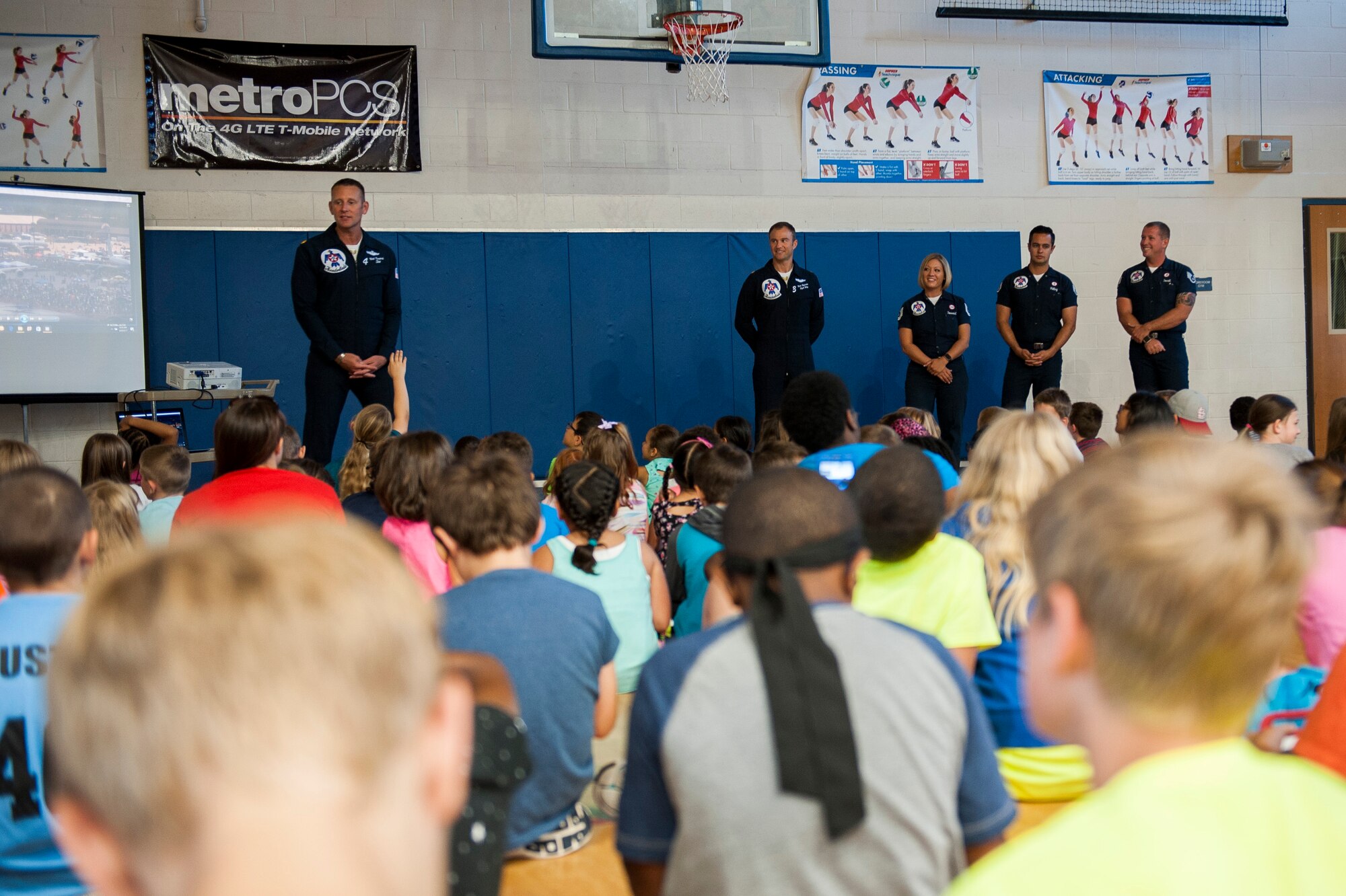 Members of the United States Air Force Thunderbirds speak with military children at Scott Air Force Base, Ill., June 9, 2017. The Thunderbirds visited the youth center and spoke about the importance of teamwork and trust. (U.S. Air Force photo by Staff Sgt. Clayton Lenhardt)