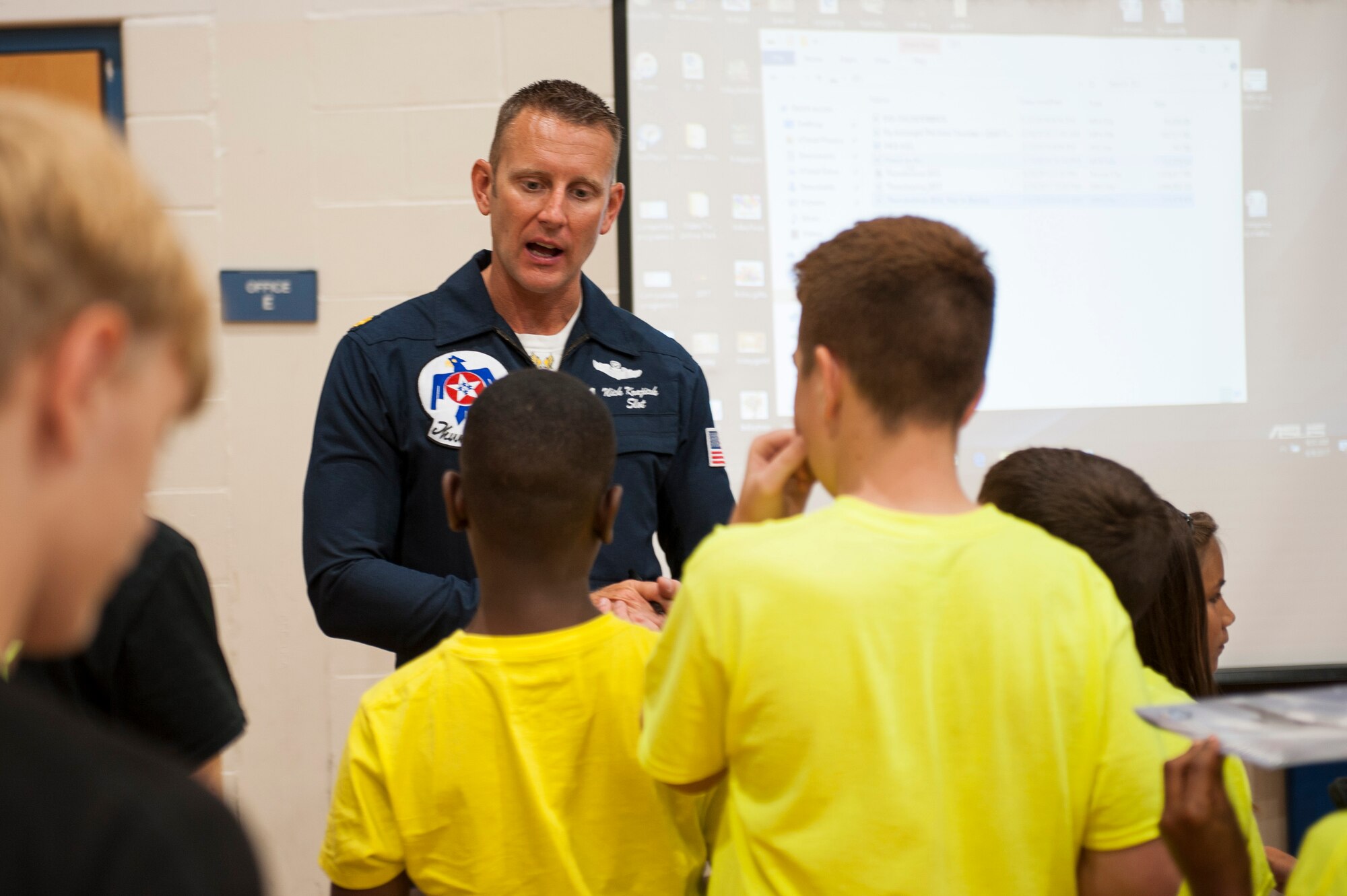 Maj. Nick Krajicek, Thunderbirds pilot, signs autographs and answers questions at Scott Air Force Base, Ill., June 9, 2017. Krajicek is the slot pilot and flies the number four jet. (U.S. Air Force photo by Staff Sgt. Clayton Lenhardt)