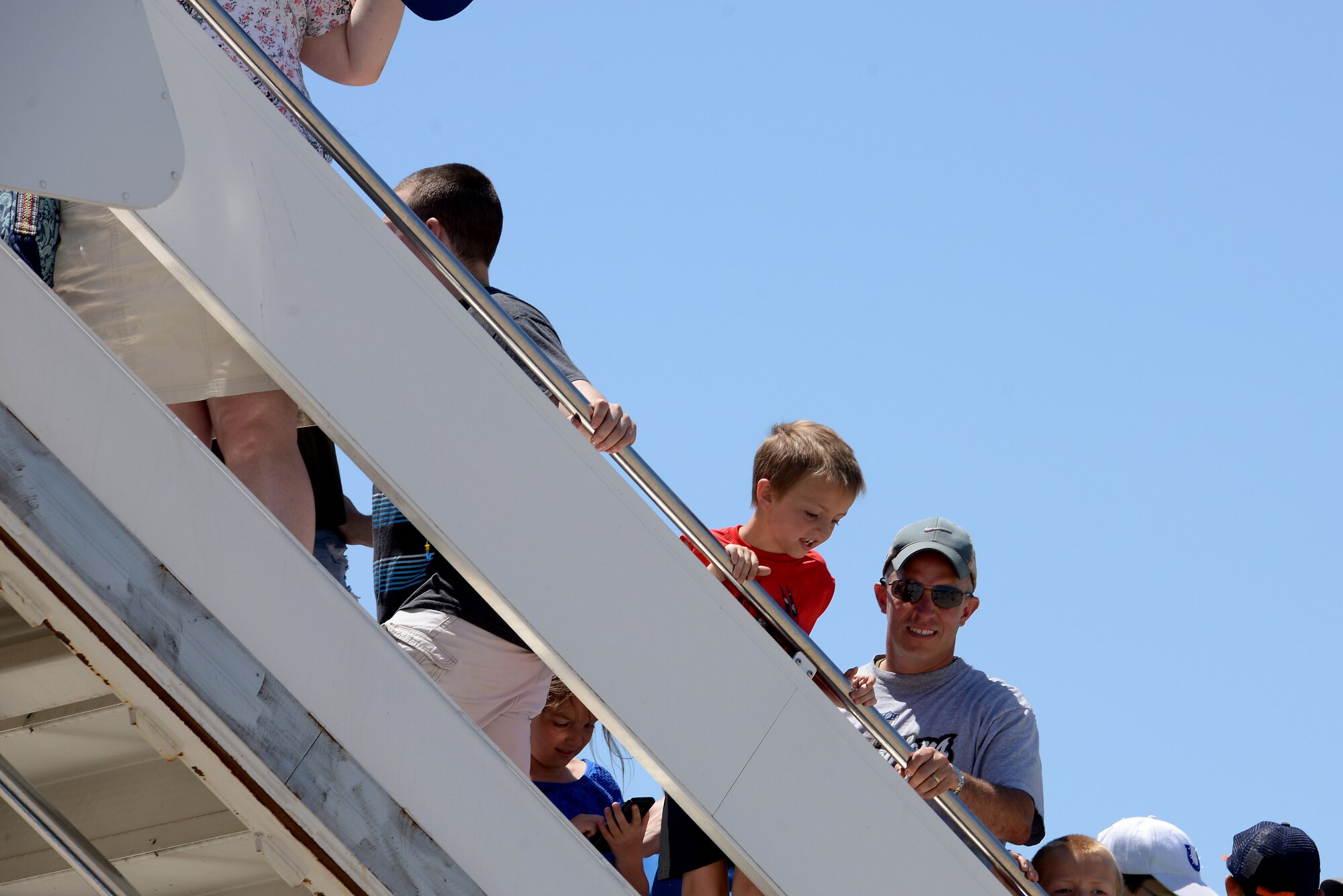 Numerous people enjoy the Scott Centennial Airshow at Scott Air Force Base, Ill., June 9, 2017. The base hosted the air show and open house to celebrate the 100th year of Scott AFB.  Over 50 aircraft, ranging from WWI’s Curtiss JN-4 Jenny to the currently utilized KC-135 Stratotanker, came to Scott, the fourth oldest Air Force base. Demonstrations included the Black Daggers, “Tora, Tora, Tora,” and the USAF Thunderbirds. Opened in 1917 and previously named Scott Field, the base has seen its mission evolve and expand to encompass a multitude of priorities, including aeromedical evacuation and communications.  Today, Scott is home to 31 mission partners and provides around-the-clock logistics support and rapid global mobility, carried out primarily by U.S. Transportation Command and Air Mobility Command. (U.S. Air Force photo by Tech. Sgt. Jonathan Fowler)