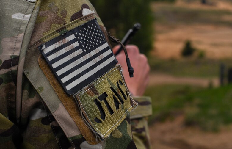 An Idaho Air National Guard joint terminal attack controller writes down notes while surveying a range during exercise Saber Strike 17 at Adazi Military Base, Latvia, June 5, 2017. During the exercise, U.S. and NATO JTACs controlled air strike operations with U.S. Air Force F-16 Fighting Falcons, a B-52 Stratofortress, and a B-1B Lancer. Saber Strike 17 continues to increase participating nations’ capacity to conduct a full spectrum of military operations. (U.S Air Force photo by Senior Airman Tryphena Mayhugh) 
