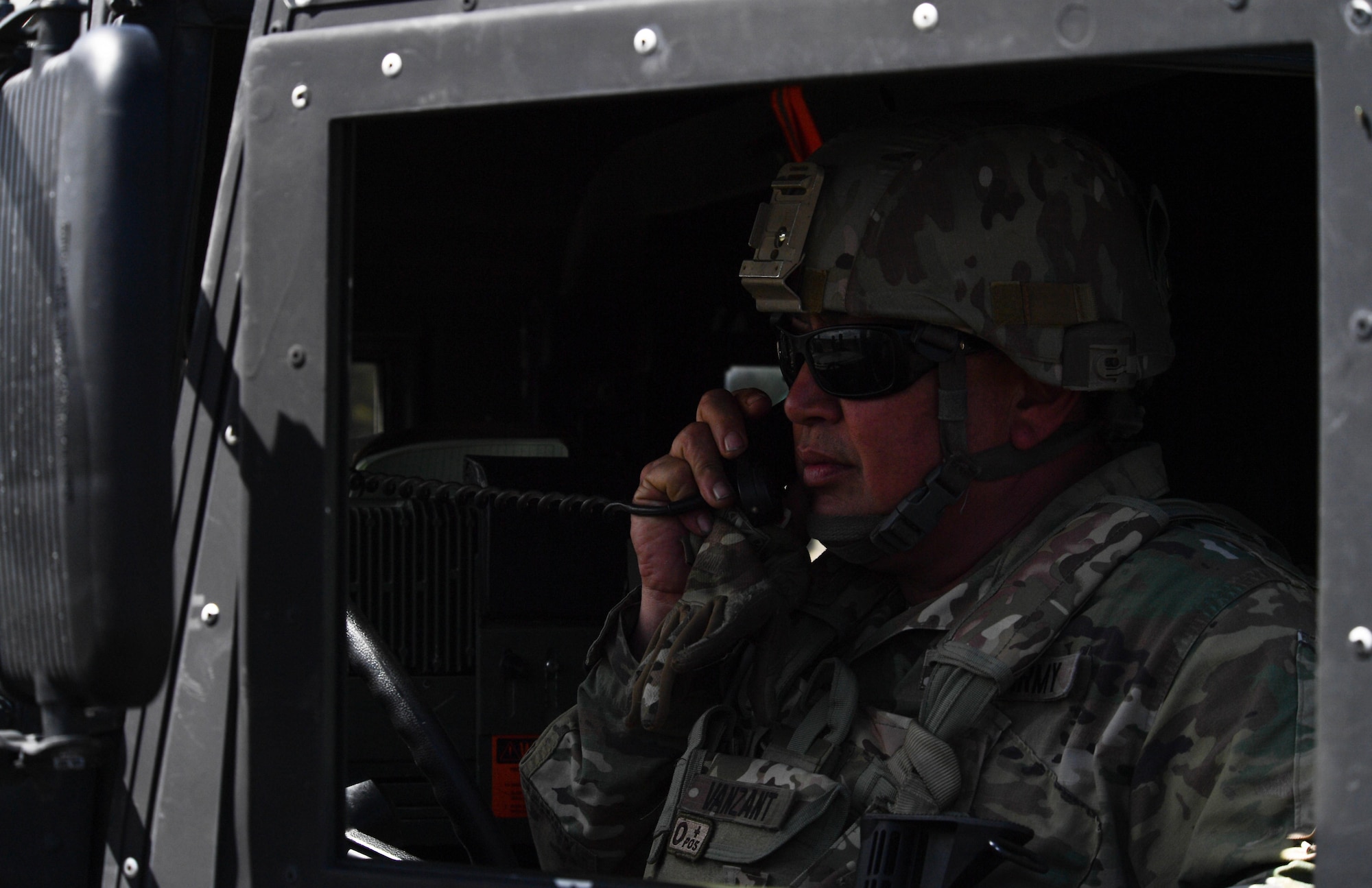U.S Army National Guard Master Sgt. Samuel Vanzant, 3rd Battalion, 157th Field Artillery operations noncommissioned officer, calls in three good missile launches to U.S. and NATO joint terminal attack controllers during exercise Saber Strike 17 at Adazi Military Base, Latvia, June 9, 2017. The U.S. and NATO JTACs worked alongside each other throughout the exercise. Participation in multinational exercises such as Saber Strike enhances professional relationships and improves overall coordination with allies and with partner militaries during times of crisis. (U.S Air Force photo by Senior Airman Tryphena Mayhugh)