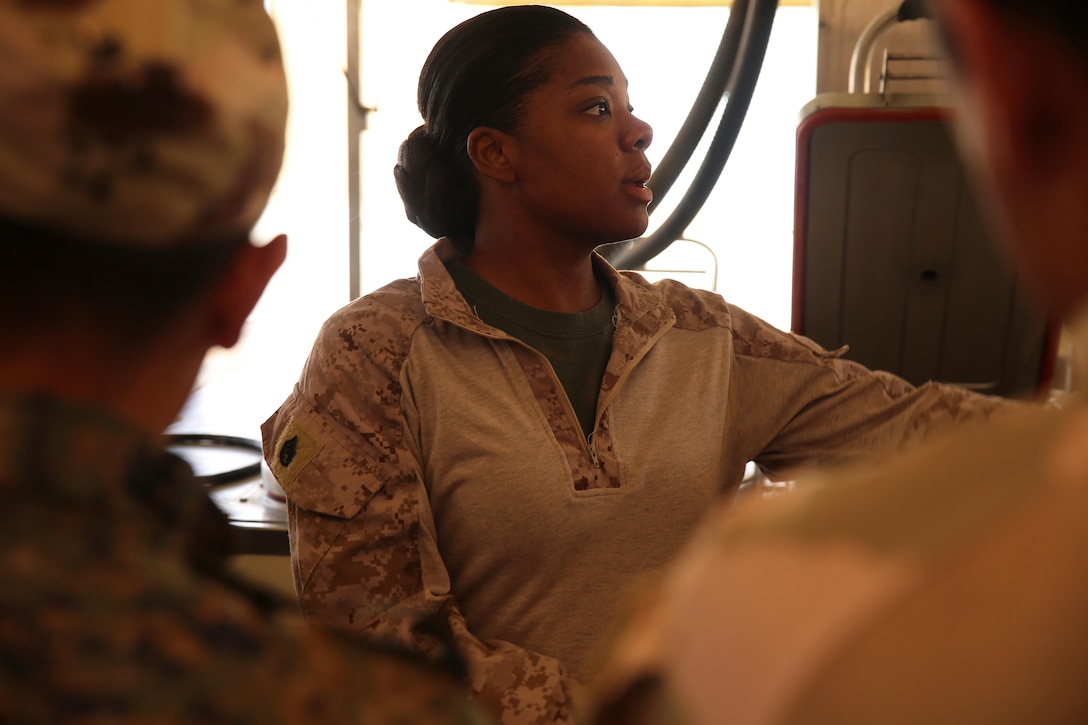 U.S. Marine Corps Staff Sgt. Shakelia Woods, a food service specialist with Special Purpose Marine Air-Ground Task Force-Crisis Response-Central Command, gives instruction on an Ozti Field Kitchen (OFK) to Iraqi soldiers with the 7th Iraqi Army Division during an advise and assist mission in support of Task Force Al Asad in Iraq May 4, 2017. Task Force Al Asad trains Iraqi forces with operationally relevant training, an integral aspect of Combined Joint Task Force-Operation Inherent Resolve, the global coalition to defeat ISIS in Iraq and Syria.(U.S. Marine Corps photo by Staff Sgt. Jennifer B. Poole) 