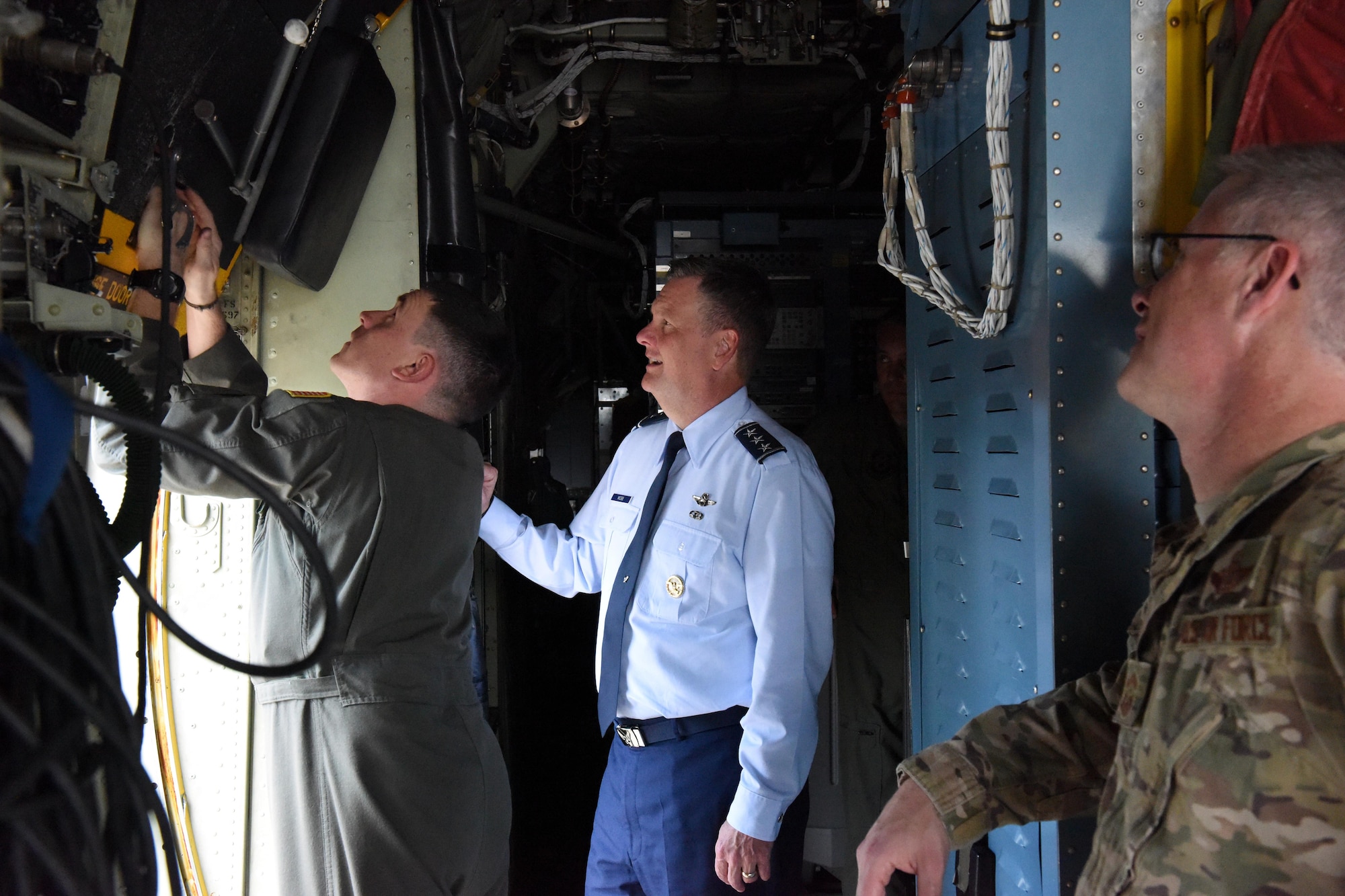 U.S. Air Force Lt. Gen. Brad Webb (center), commander of Air Force Special Operations Command, and Chief Master Sgt. Gregory Smith, command chief master sergeant of Air Force Special Operations Command, listen to Master Sgt. Stanley Hain, 193rd Special Operations Wing loadmaster, brief on ground egress aboard an EC-130J Solo aircraft at Middletown, Pennsylvania, June 9, 2017. Webb flew the solo to the 193rd Air Operations Group at State College, Pennsylvania, the following day. (U.S. Air National Guard photo by Master Sgt. Culeen Shaffer/Released)