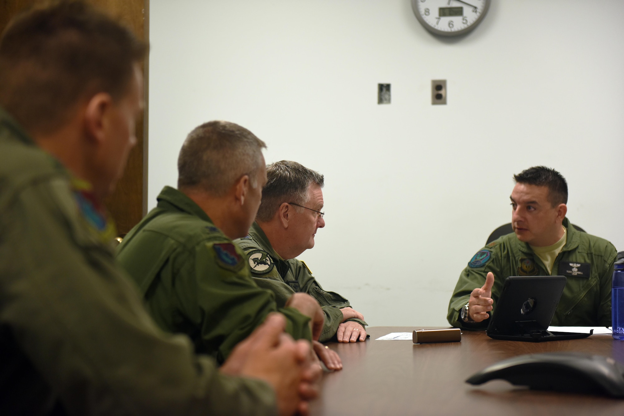 Major Todd Campbell, a pilot with the 193rd Special Operations Group, Middletown, Pennsylvania, briefs U.S. Air Force Lt. Gen. Brad Webb (front left), commander of Air Force Special Operations Command, on his plans for flying the EC-130J Commando Solo June 10, 2017. Webb is a command pilot with more than 3,700 flying hours, including 117 combat hours in Afghanistan, Iraq and Bosnia. (U.S. Air National Guard photo by Senior Airman Julia Sorber/Released)