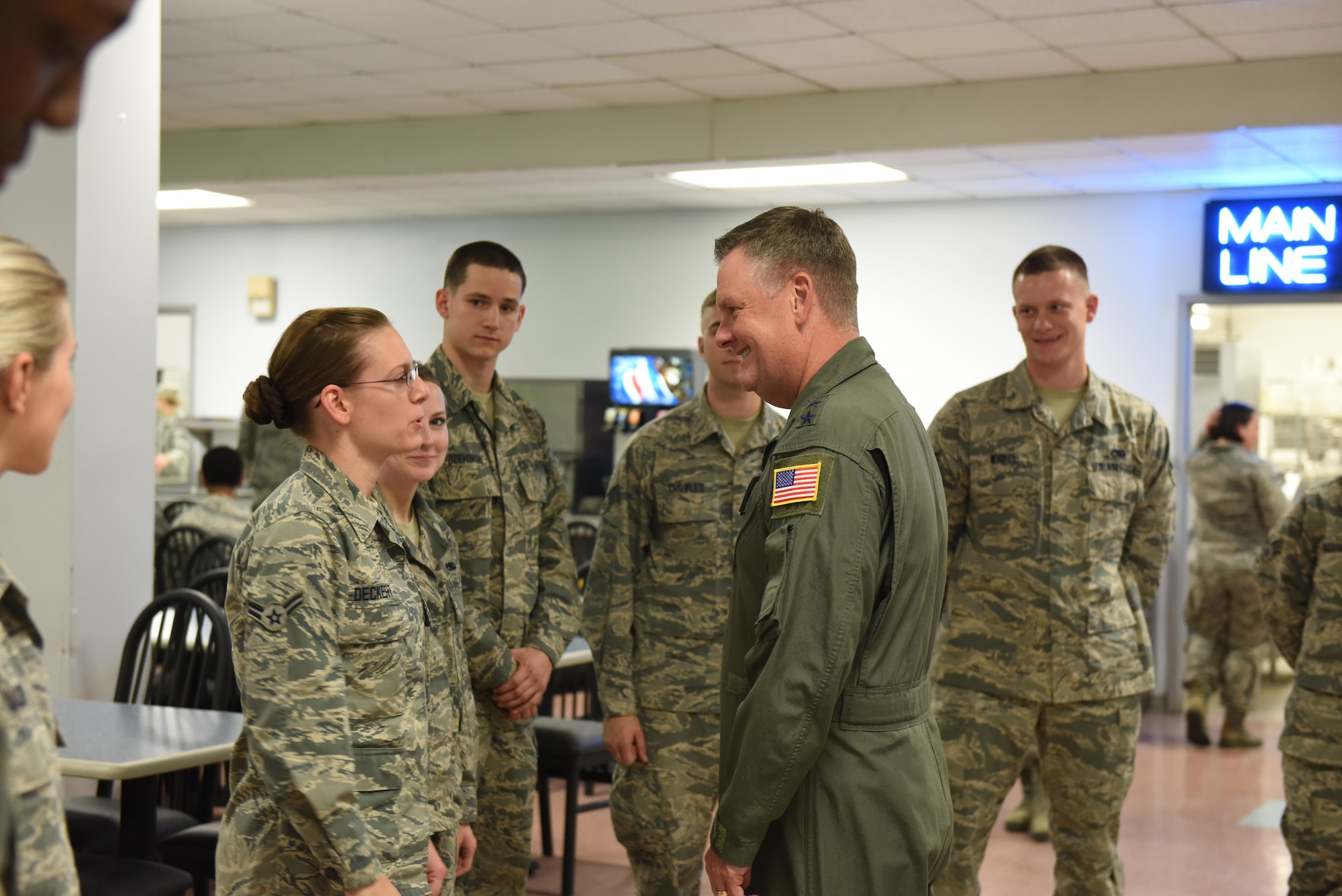 Airman 1st Class Stephanie Deckert, 193rd Special Operations Maintenance Squadron, meets U.S. Air Force Lt. Gen. Brad Webb, commander of Air Force Special Operations Command, during his visit to the 193rd Special Operations Wing, Middletown, Pennsylvania. Deckert was selected, along with other wing Airmen, to dine with Webb on base June 10, 2017. “I’m appreciative that he took the time to have lunch with us,” said Deckert. “It gave us the chance to hear about his life and family. It also makes my work at the wing feel valued.” (U.S. Air National Guard photo by Tech. Sgt. Claire Behney/Released)