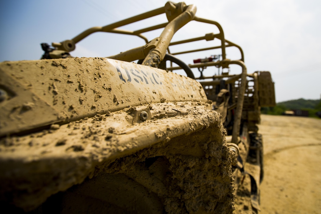 U.S. Marines assigned to Weapons Company, 3rd battalion, 8th Marine Regiment, forward deployed to the 3rd Marine Division, as part of the forward Unit Deployment Program, utilize the Utility Task Vehicle and explore its capabilities at Story Live Fire Complex South Korea, June 9, 2017. The UTV is the most recent advancement in the capabilities and mobility of marines.