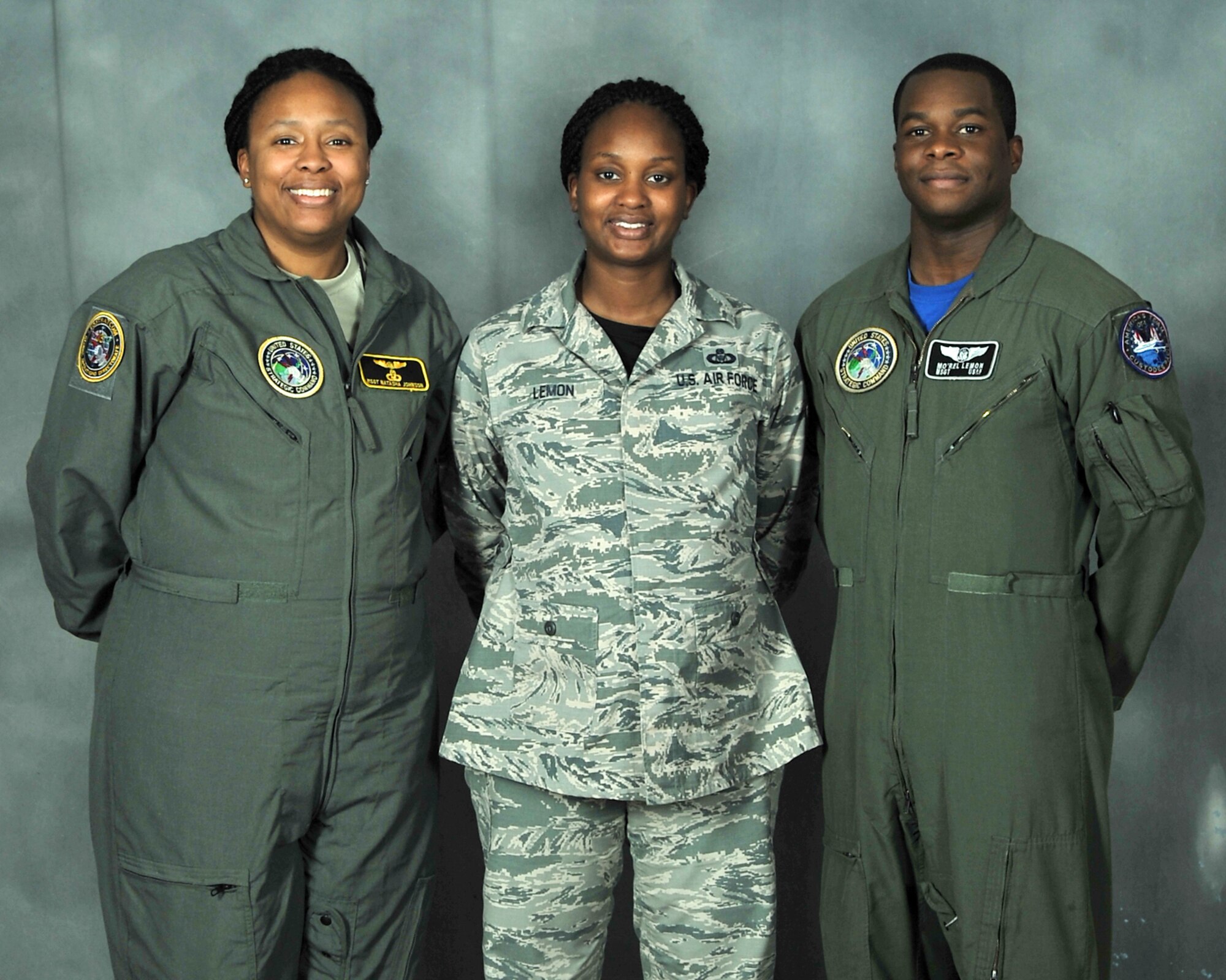(L to R) Pictured are siblings Master Sgt. Natasha Johnson and Master Sgt. Terri Lemon and Terri’s husband Master Sgt. Mo’rel Lemon. They are all stationed at Offutt Air Force Base, Nebraska, and their family is tied together in many unique ways including rank and career field. (U.S. Air Force photo by Charles Haymond)