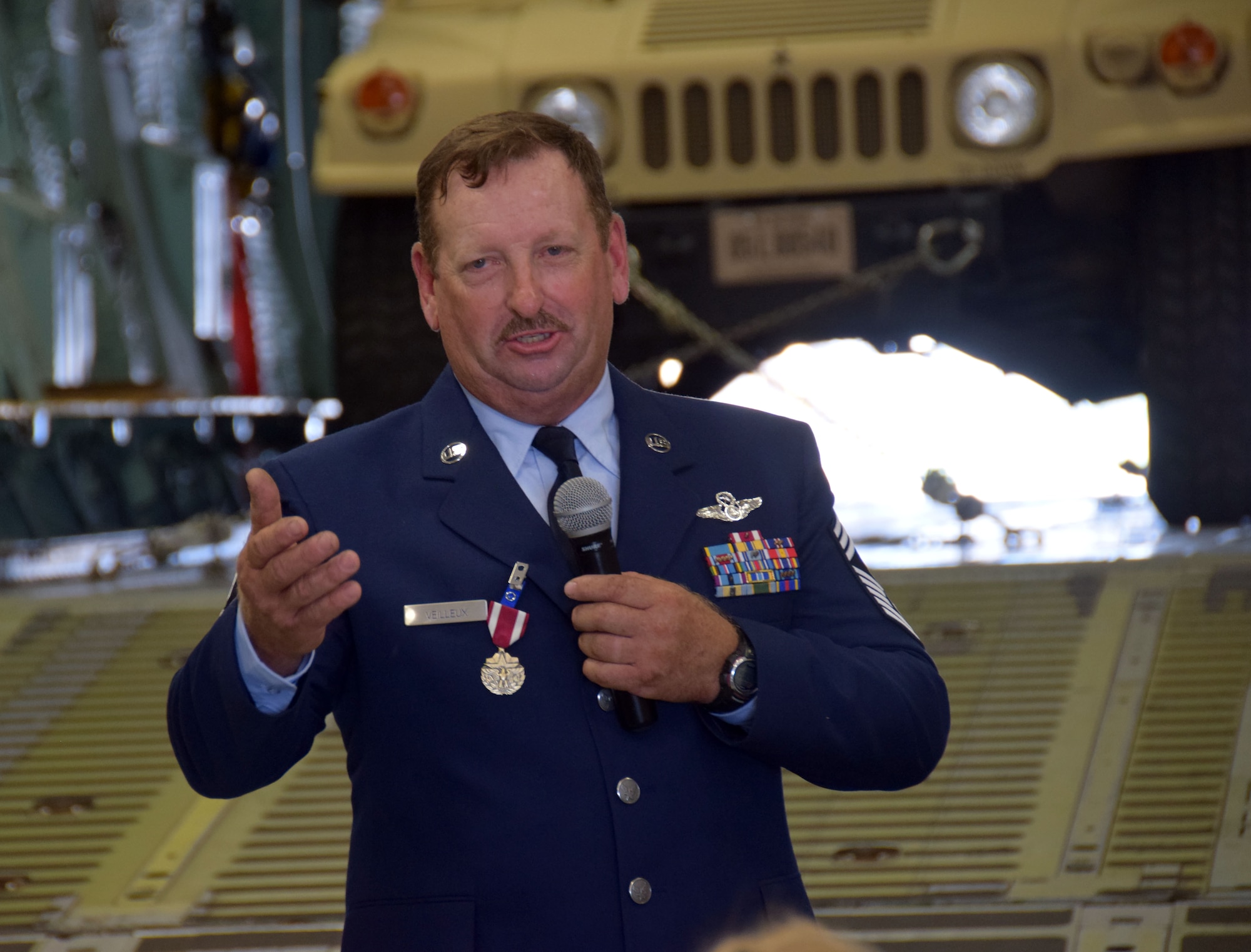 Chief Master Sgt. Thomas J. Veilleux Sr., 356th Airlift Squadron’s Formal Training Unit superintendent, speaks to the crowd during his retirement ceremony from the United States Air Force Reserve June 11, 2017 at the Cargo Loading Training Facility at Joint Base San Antonio-Lackland, Texas.  Chief Veilleux and his wife of 34 years Diane will continue to make their home in San Antonio. (U.S. Air Force photo by Tech. Sgt. Carlos J. Trevino)