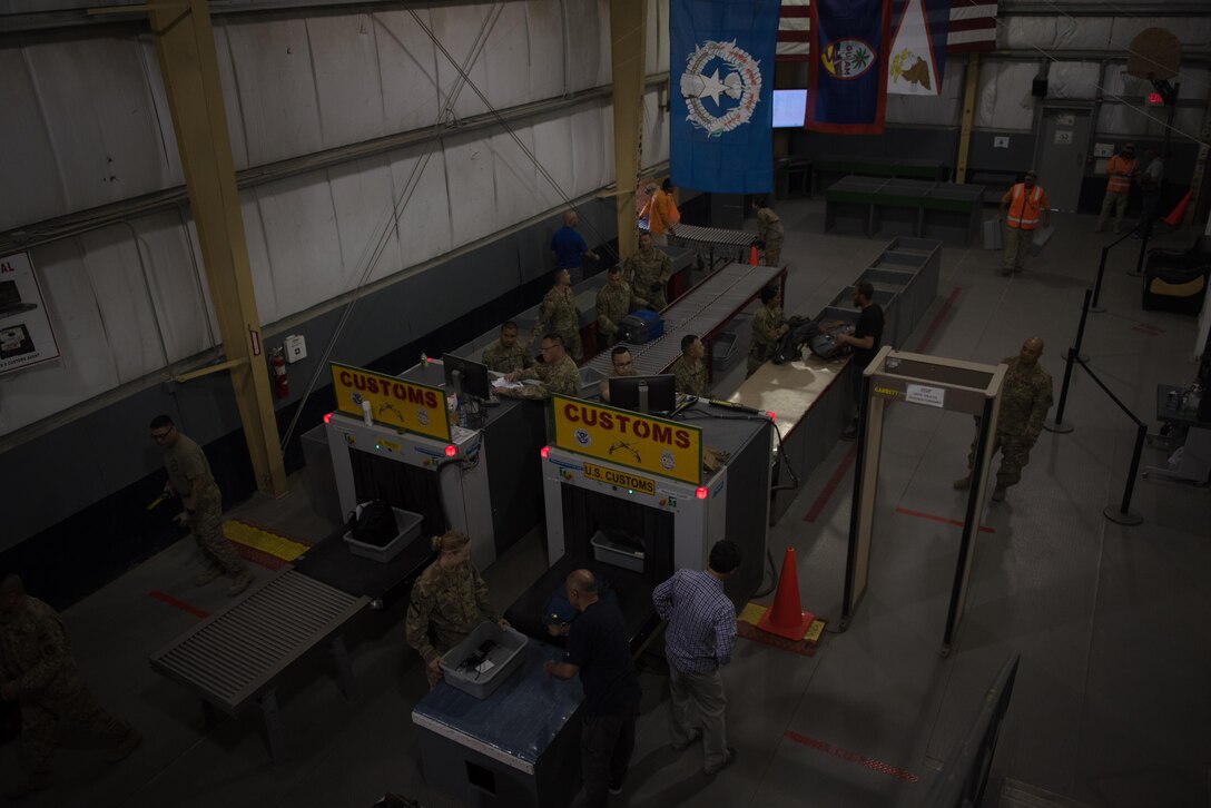 Soldiers assigned to the 368th Military Police Company from Guam process personnel out of Bagram Airfield, Afghanistan, April 30, 2017. The customs office is responsible for inspecting personnel and cargo leaving Afghanistan and the Central Command area of responsibility. (U.S. Air Force photo by Staff Sgt. Benjamin Gonsier) 