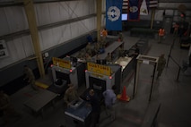 Soldiers assigned to the 368th Military Police Company from Guam process personnel out of Bagram Airfield, Afghanistan, April 30, 2017. The customs office is responsible for inspecting personnel and cargo leaving Afghanistan and the Central Command area of responsibility. (U.S. Air Force photo by Staff Sgt. Benjamin Gonsier) 