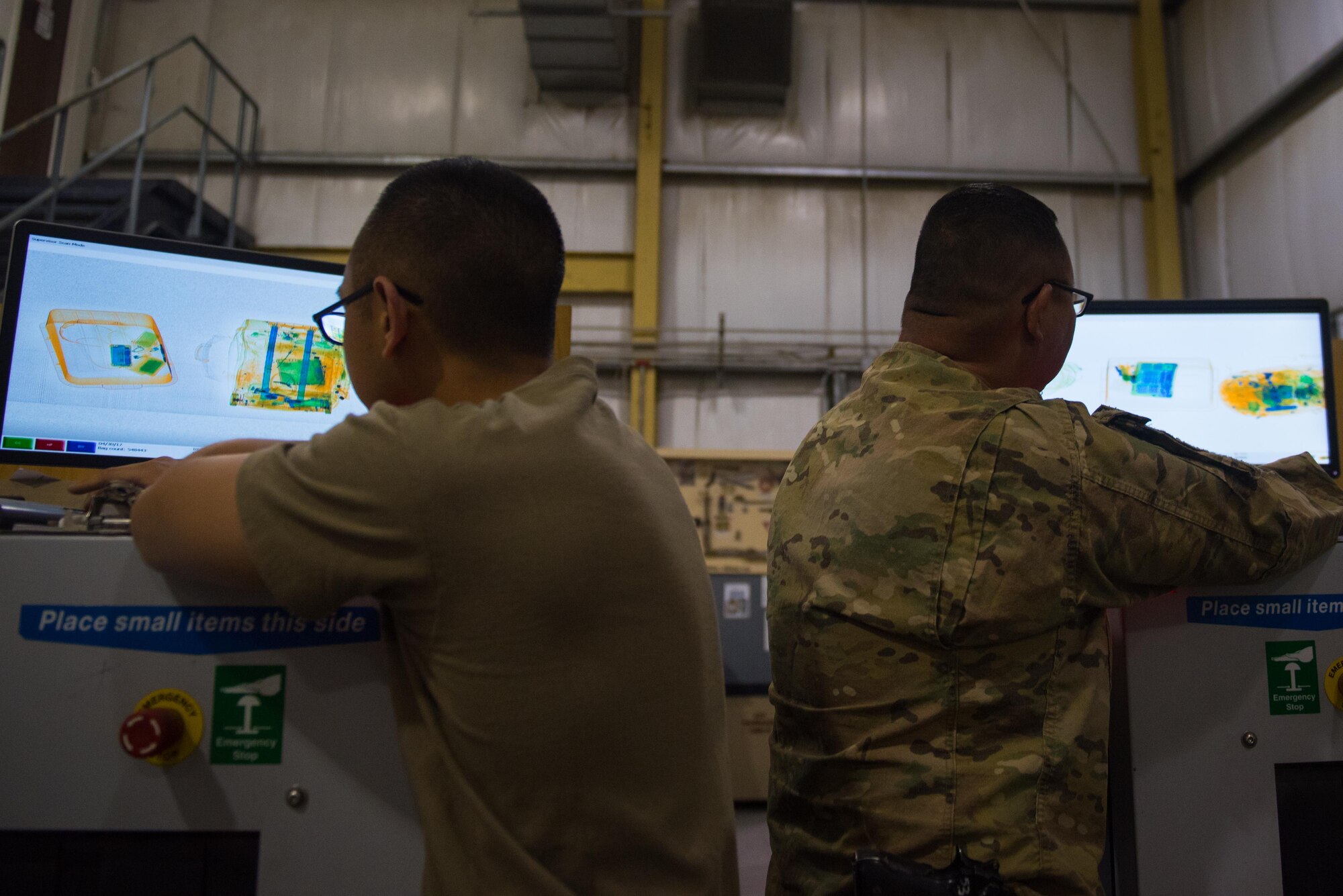 Soldiers assigned to the 368th Military Police Company from Guam scan through luggage at Bagram Airfield, April 30, 2017. The 368th Military Police Company is a U.S. Army Reserve organization based out of Guam, which is located on a 210-square-mile island in the middle of the Pacific Ocean. (U.S. Air Force photo by Staff Sgt. Benjamin Gonsier)