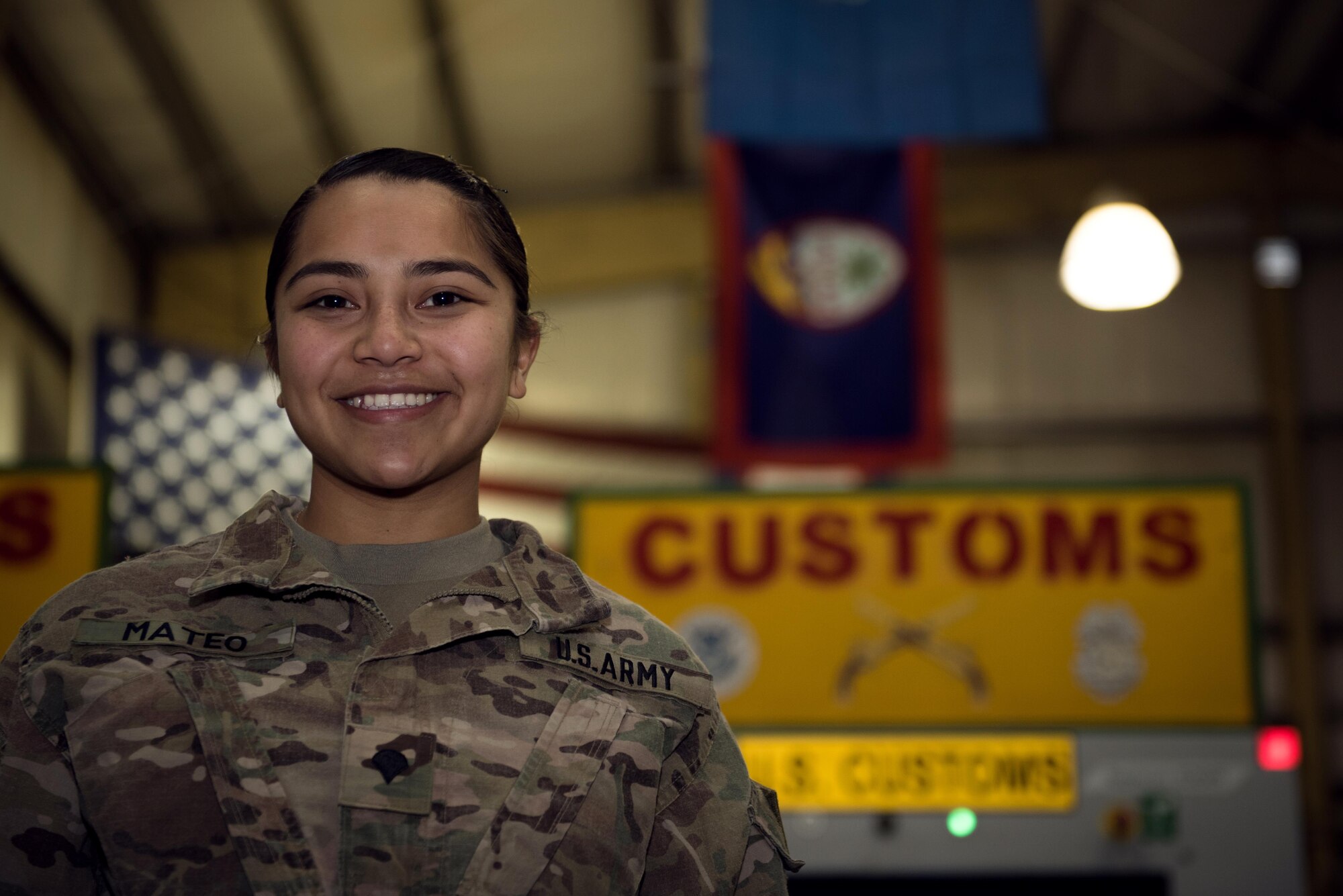 U.S. Army Spc. Michelle Mateo is deployed to Bagram Airfield, Afghanistan, as a customs agent for the base. She is assigned to the 368th Military Police Company, which is located on Guam, a 210-square-mile island in the middle of the Pacific Ocean. As a customs agent, Mateo inspected personnel and cargo leaving Afghanistan and the Central Command area of responsibility. (U.S. Air Force photo by Staff Sgt. Benjamin Gonsier)