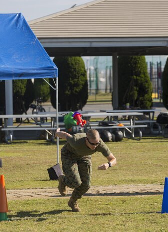 U.S. Marine Corps Gunnery Sgt. Carrie White, the Provost Marshal’s Office training chief with Headquarters and Headquarters Squadron, conducts the prone 300 yard shuttle during the third annual High Intensity Tactical Training championship preliminaries at Marine Corps Air Station Iwakuni, Japan, June 9, 2017. The event brought together the Marine Corps’ toughest male and female athletes to face off in obstacles that test their speed, endurance, strength and agility. Preliminary winners are slated to fly from their respective installations to compete at Marine Corps Base Camp Pendleton, California, August 28-31, 2017, to be crowned the ‘Ultimate Tactical Athlete.’ (U.S. Marine Corps photo by Lance Cpl. Mason Roy)