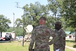 Army Maj. Adrian Smith, right, Disaster Incident Response Emergency Communications Terminal (DIRECT) project lead for Project Manager Warfighter Information Network-Tactical (PM WIN-T), who is also a member of the Florida Army National Guard (ARNG), briefs Col. Mark Tellier, Michigan ARNG G6 during a DIRECT demonstration at the 2017 ARNG G6 (communications officer) Mission Command Workshop in Little Rock, Ark., on May 15, 2017. 