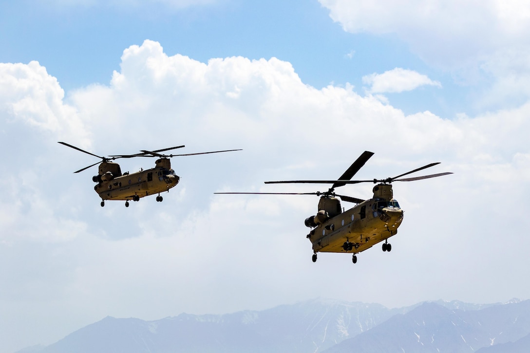 Army CH-47 Chinook helicopters prepare to land at Bagram Airfield, Afghanistan, June 9, 2017. The crews are assigned to the 7th Infantry Division’s 16th Combat Aviation Brigade, Task Force Flying Dragons. Army photo by Capt. Brian Harris         