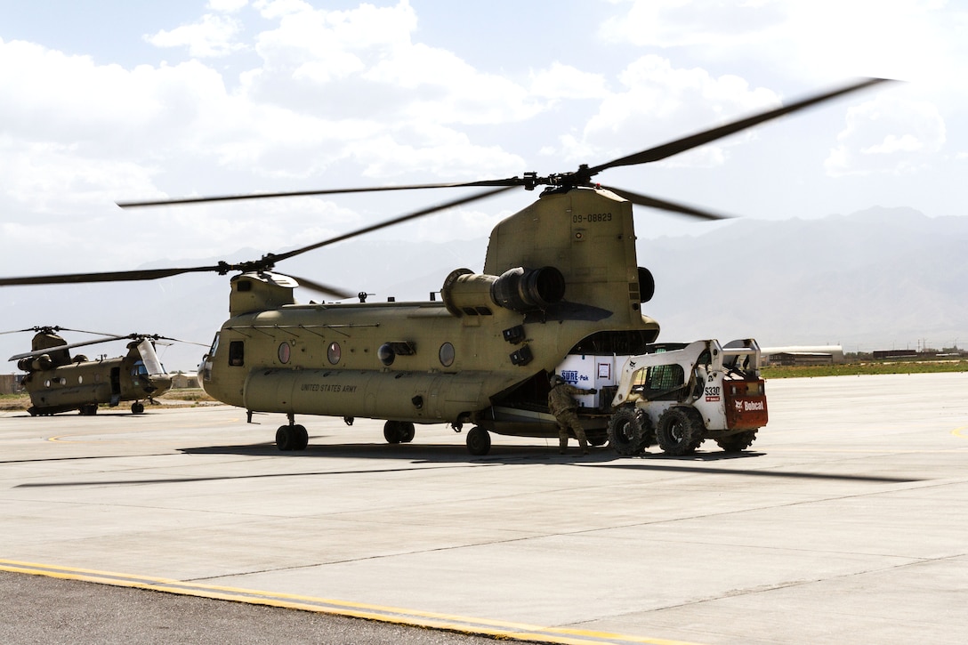 Soldiers load cargo onto a CH-47 Chinook helicopter at Bagram Airfield, Afghanistan, June 9, 2017. Army photo by Capt. Brian Harris