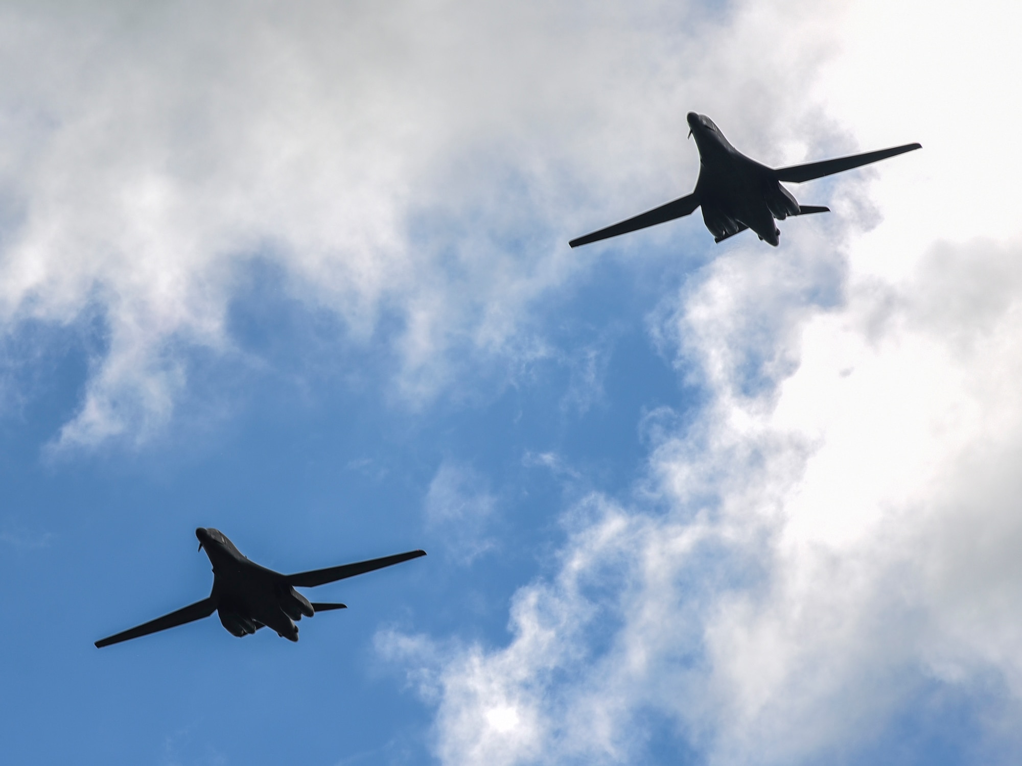 Two B-1B Lancers from Ellsworth Air Force Base, S.D., fly over Royal Air Force Fairford, U.K., June 8, 2017. Aircrew from the 37th Bomb Squadron are participating in bomber assurance and deterrence missions in the European theatre that provide bomber crews opportunities to train with allies and partners in joint and multinational exercises such as BALTOPS and Saber Strike. (U.S. Air Force photo by Airman 1st Class Randahl J. Jenson)
