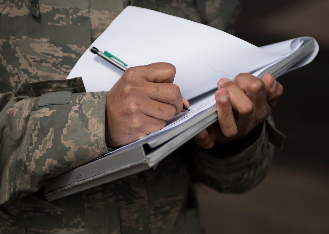 U.S. Air Force Tech. Sgt. Bobby McMillian, 28th Aircraft Maintenance Squadron expediter, updates a munitions tracking sheet at Royal Air Force Fairford, U.K., June 7, 2017. Airmen from Ellsworth Air Force Base, S.D., are participating in bomber missions in the European theatre that provide opportunities to train with allies and partners in joint and multinational exercises such as BALTOPS and Saber Strike. (U.S. Air Force photo by Airman 1st Class Randahl J. Jenson)