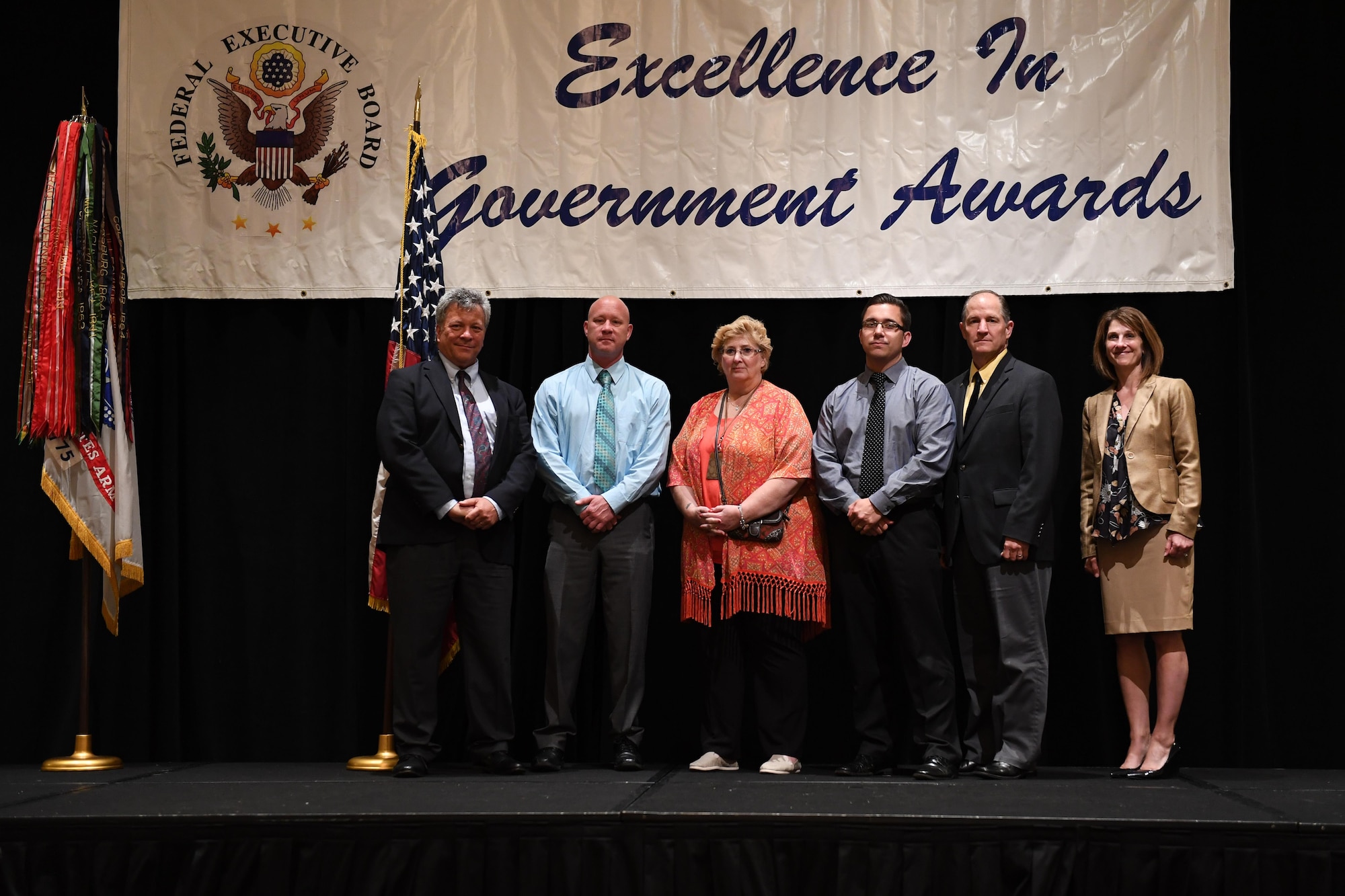 Members of the 911th Airlift Wing Financial Management Office stand with John Dumont, District Director of the Pittsburgh Federal Executive Board and Jennifer Vandermolen, chair of the Excellence in Government Awards Program, to be recognized at the 2017 Excellence in Government Awards Program May 26, 2017, at the Westin Convention Center Hotel, Pittsburgh, Pa. The ceremony, hosted by the Pittsburgh Federal Executive Board, is an annual event to honor federal employees in the Pittsburgh area who have gone above and beyond in their jobs. (U.S. Air Force photo by Senior Airman Beth Kobily)