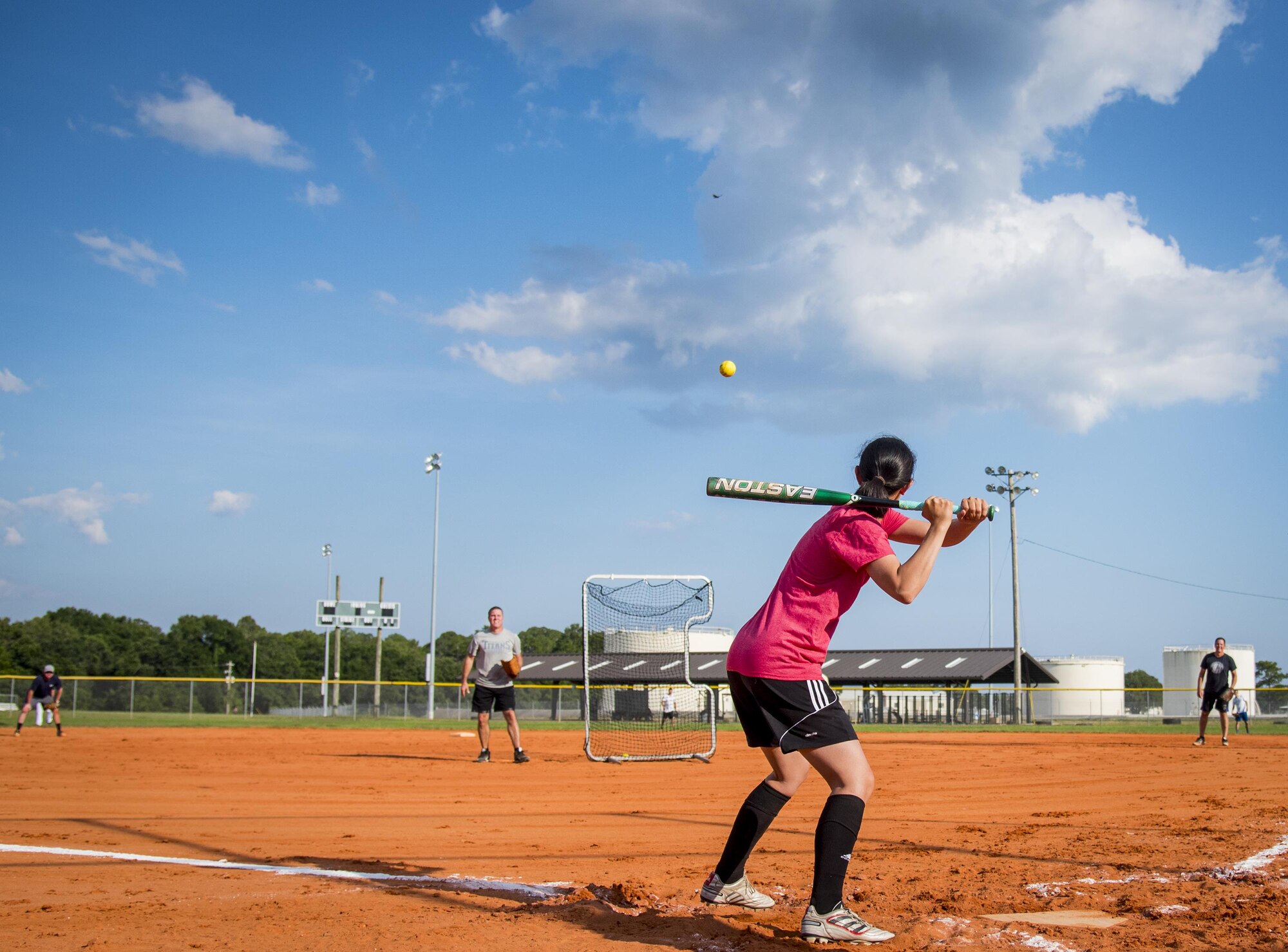 An Air Force Research Lab team member takes her turn at bat during an intramural softball game at Eglin Air Force Base, Fla., June 8.  The Armament Directorate team bashed the hapless AFRL team 14-4 in five innings of play.  (U.S. Air Force photo/Samuel King Jr.)