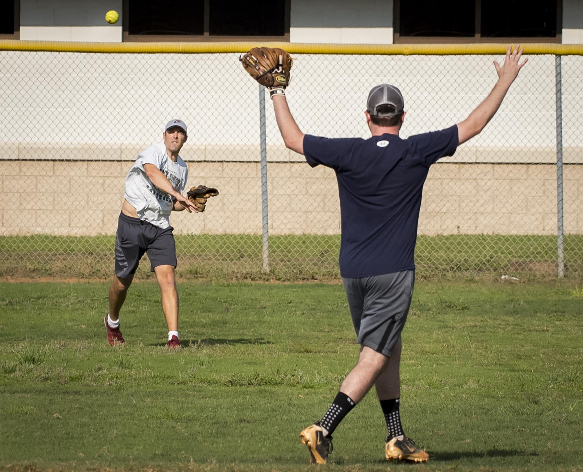 The Armament Directorate team’s outfielder throws to his cut-off man during an intramural softball game at Eglin Air Force Base, Fla., June 8.  The EB team bashed the hapless Air Force Research Lab team 14-4 in five innings of play.  (U.S. Air Force photo/Samuel King Jr.)
