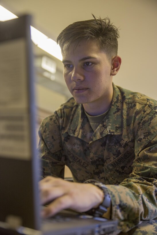 Lance Cpl. Xander Gonzalez a data Marine with Marine Wing Support Squadron 473, Marine Aircraft Group 41, 4th Marine Air Wing, Marine Forces Reserve, types code into his computer at Canadian Forces Base Cold Lake during exercise Maple Flag 50, June 2, 2017. When not training at his monthly drill or annual training, Gonzales works as an elementary school computer technician, applying his military occupational specialty to his civilian job. (U.S. Marine Corps photo by Lance Cpl. Niles Lee/Released)