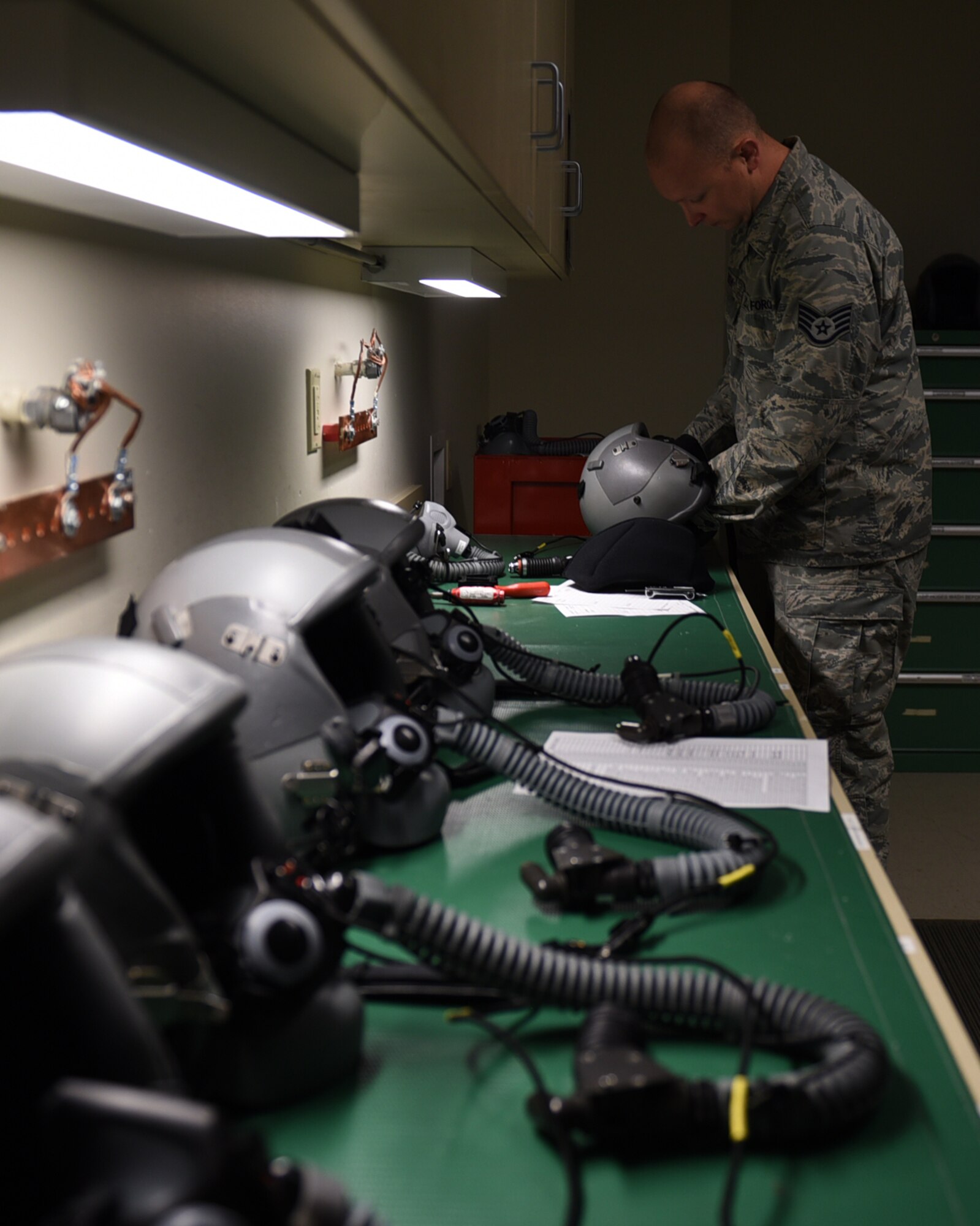 Staff Sgt. Robert Roden, 19th Operations Support Squadron Aircrew Flight Equipment craftsman, performs a quality check on oxygen masks June 9, 2017, at Little Rock Air Force Base, Ark. AFE Airmen maintain, repair and distribute helmets and oxygen mask to pilots before every mission. (U.S. Air Force photo Airman 1st Class Kevin Sommer Giron)