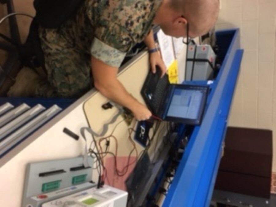 Lance Corporal Shawn W. Cross is seen here troubleshooting a circuit card with the assistance of the AN/USM-674, which allows the user to compare and analyze signatures of electronic components and circuits.  This is part of the training Marines receive within the Micro-Miniature Repair Course as they identify broken component and execute the appropriate repairs.  Lance Corporal Cross will attain the additional MOS 8641 and greatly enhance the capabilities of his unit.  The Marine will then return to his parent command and help share the knowledge and skills he has gained throughout the course.