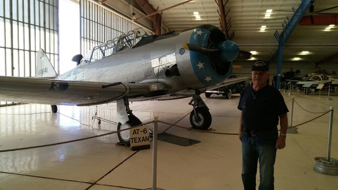 Col. (ret) Forrest “Dutch” Kissinger poses in front of a T-6 Texan. Kissinger enlisted in the Air Force in 1949, he later earned the opportunity to commission and become a pilot. 