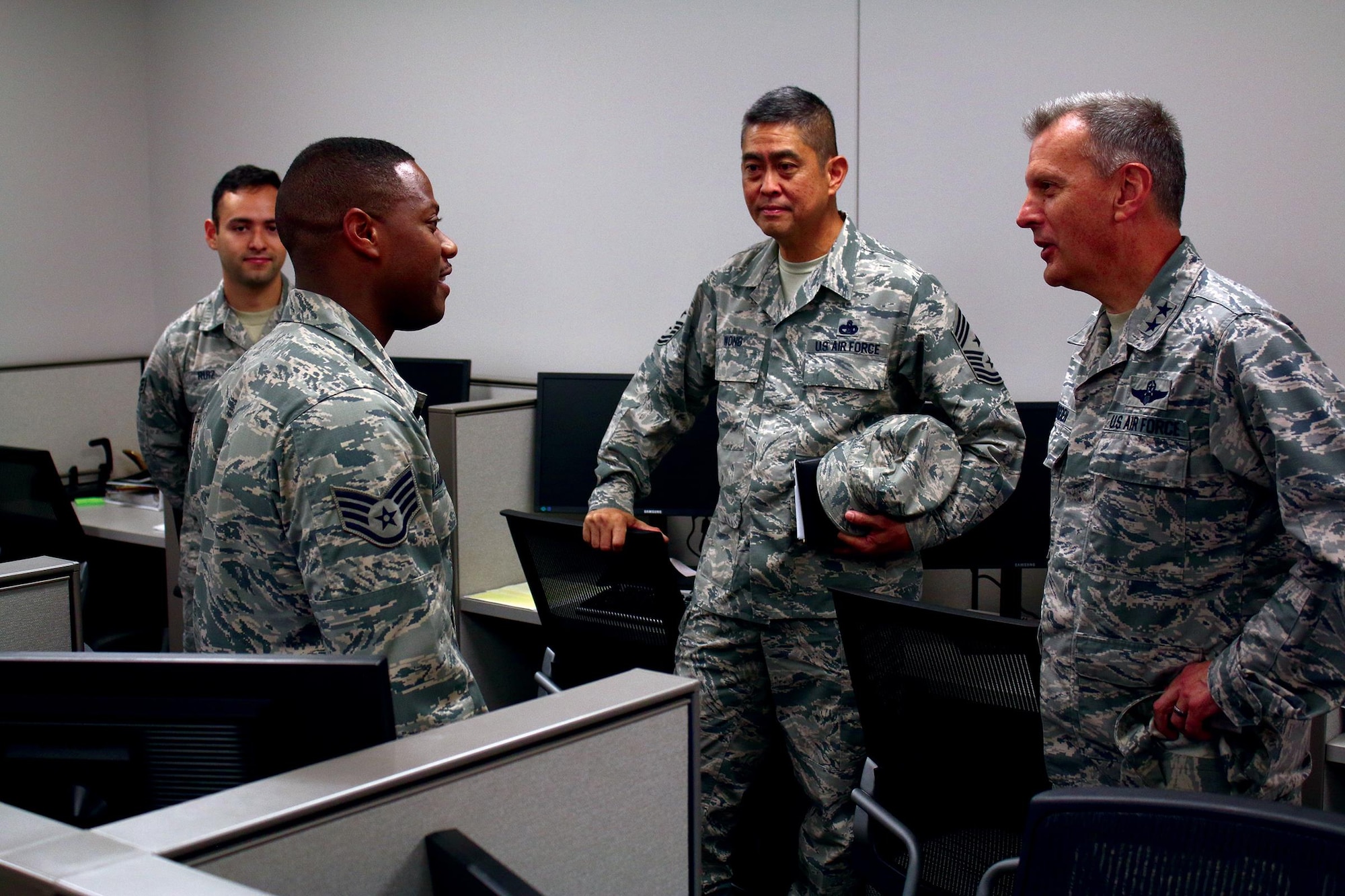 Staff Sgt. Anthony Lauderdale, 445th Civil Engineer Squadron structural journeyman, shares his experiences working for the 445th CES with Maj. General Randall Ogden, 4th Air Force commander and Chief Master Sgt. Brian Wong, 4th Air Force command chief, May 20, 2017. (U.S. Air Force photo/Tech. Sgt. Patrick O’Reilly)
