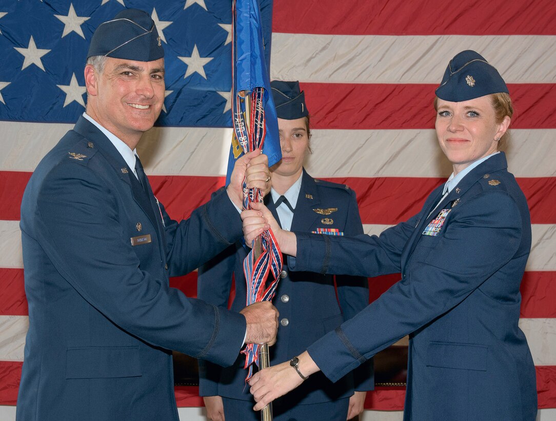 Lt. Col. Deirdre Gurry, right, accepts the guidon and command of the 8th Flying Training Squadron from Col. Paul Johnson, 71st Operations Group commander, during a change of command ceremony June 9, at Vance Air Force Base, Oklahoma. (U.S. Air Force photo/ Terry Wasson)