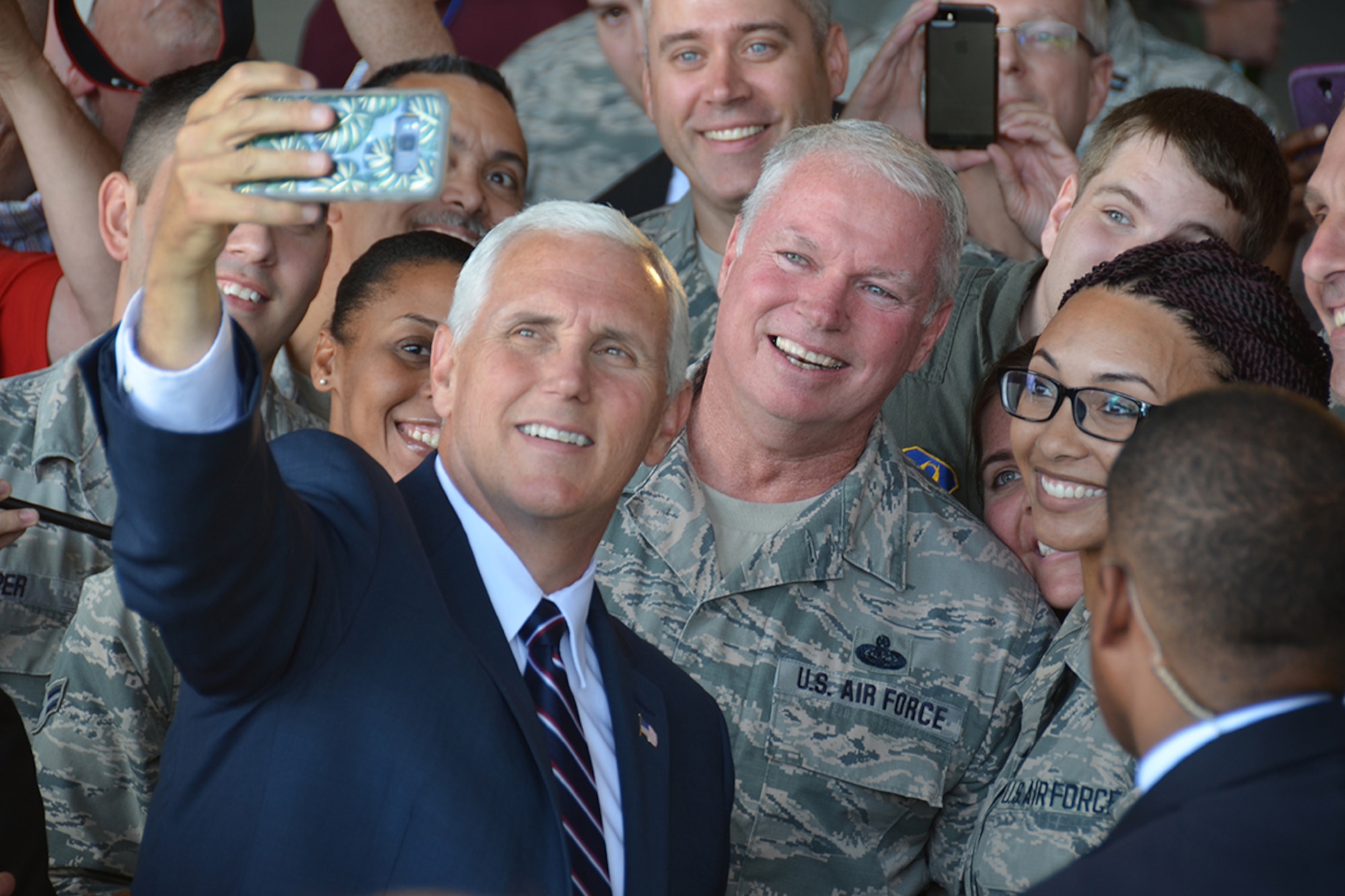 Vice President Mike Pence takes a selfie with military members during a visit to Dobbins Air Reserve Base, Georgia June 9, 2017. While recognizing it as the largest joint service training Reserve base in the world, Pence pledged the administration’s full support of our service members and national defense. (U.S. Air Force photo/Tech. Sgt. Kelly Goonan)