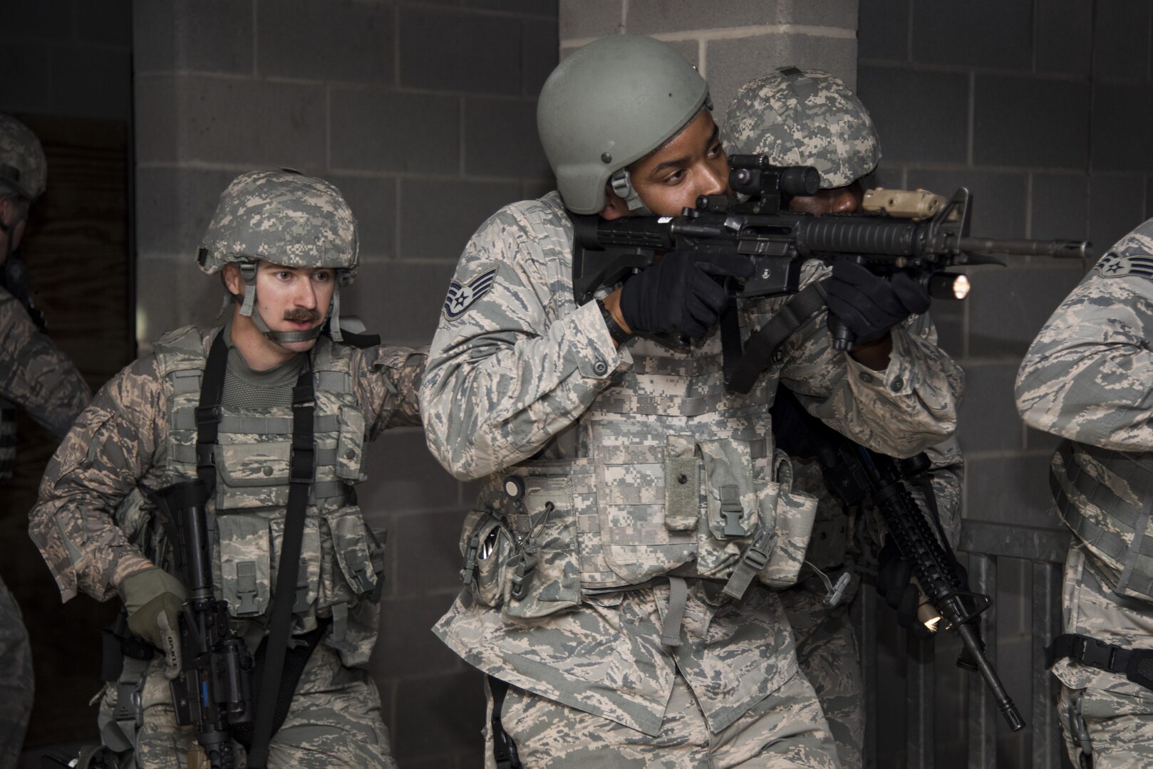 502nd Security and Readiness Group security forces Airmen practice clearing a building June 9, 2017, at Joint Base San Antonio-Camp Bullis, Texas. Thousands of service members train at JBSA-Camp Bullis every year to fulfill operational requirements, including security forces and combat medic training.