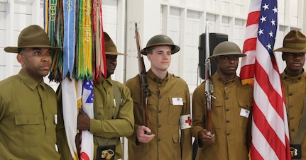 (From left) U.S. Army Reserve Spc. Brandon Mosley, Spc. Randy Davis, Spc. Kyle McCracken, Spc. Rashad Roberts and  Spc. Christopher Hunter, all with the 90th Sustainment Brigade based out of Little Rock, Ark., serve as the color guard May 20 at a World War I commemoration in San Antonio at Hangar 9 of Brooks City Base. The event was hosted by the City of San Antonio Department of Military Affairs to honor those who served in World War I.