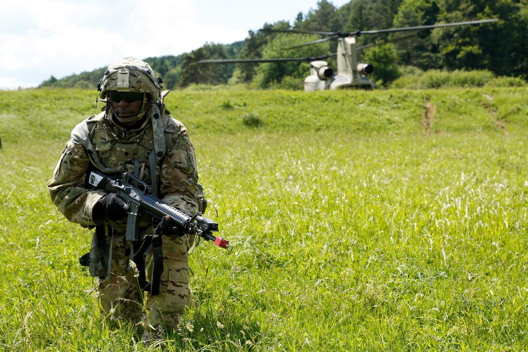 A soldier assigned to 1st Battalion, 501st Aviation Regiment, is at the ready during vehicle recovery operations during Exercise Combined Resolve VIII at Hohenfels Training Area, Germany, June 8, 2017. Exercise Combined Resolve VIII is a multinational exercise designed to train the Army’s Regionally Allocated Force for the U.S. European Command. The exercise will include more than 3,400 participants from 10 nations. The goal of the exercise is to prepare forces in Europe to operate together to promote stability and security in the region. Army photo by Spc. Michael Bradley 