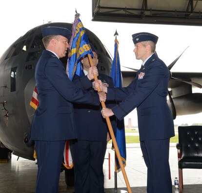 U.S. Air Force Col. Lance Schmidt, left, 752d Special Operations Group commander, passes the 352d Special Operations Support Squadron guidon to Lt. Col. Scott Giller, right, 352d SOSS commander, June 8, 2017, on RAF Mildenhall, England. Giller previously served as the 1st Special Operations Mission Support Group deputy commander, Hurlburt Field, Fla. (U.S. Air Force photo by Airman 1st Class Luke Milano)