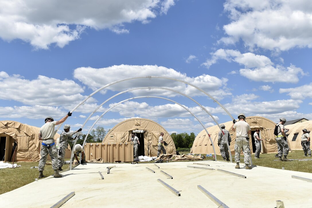 Members from the 821st Contingency Response Group, work on setting-up “tent city” during Exercise Turbo Distribution 17-02, June 7, 2017, at Battle Creek Air National Guard Base, Mich.  Approximately 120 Airmen from the 821st CRG stationed at Travis Air Force Base, California, deployed as part of a Joint Task Force Port-Opening exercise, June 6-15.  (U.S. Photo by Tech. Sgt. Liliana Moreno/Released)
