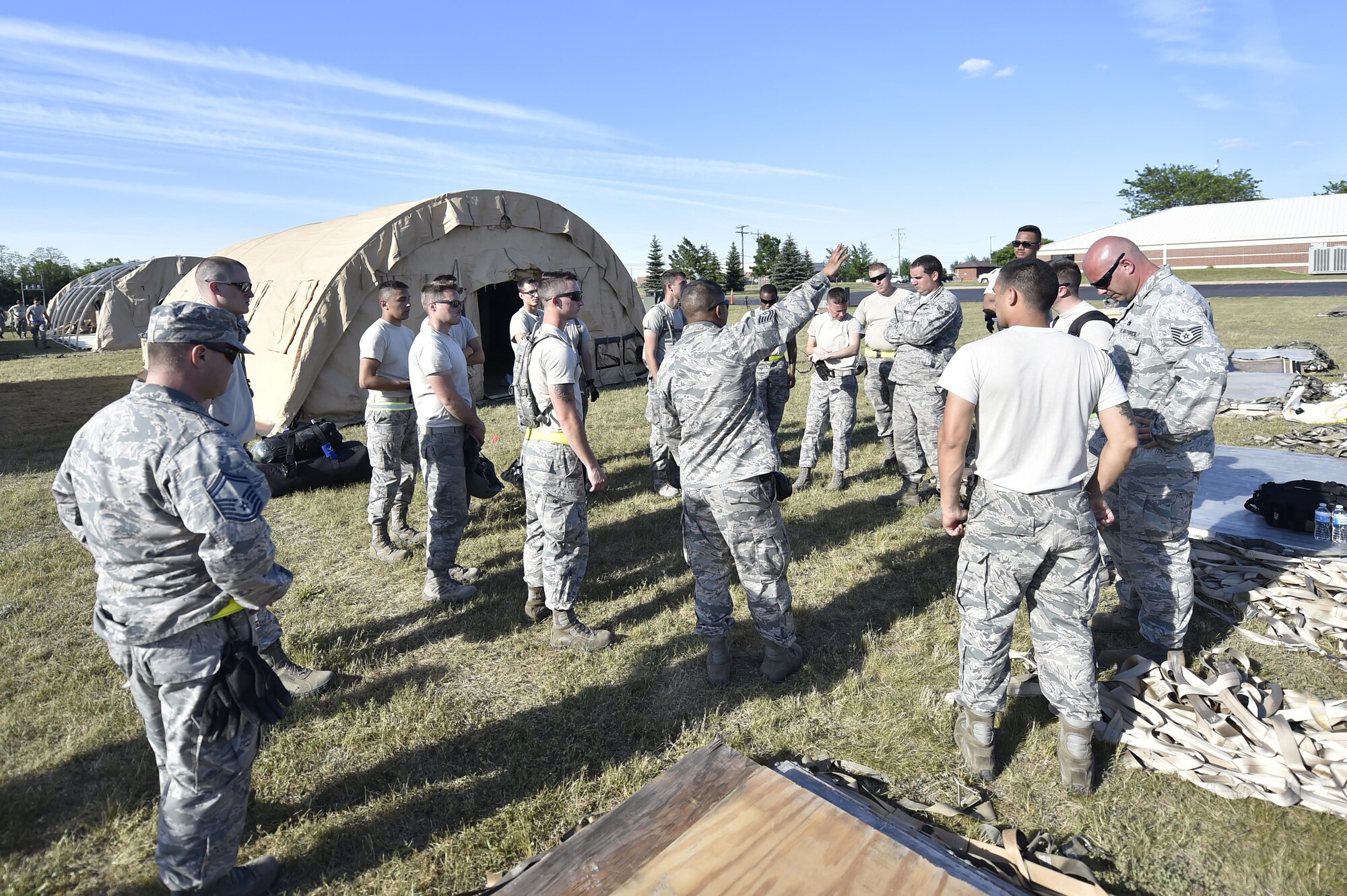 Aerial porters from the 821st Contingency Response Group get a mission brief during Exercise Turbo Distribution 17-02, June 7, 2017, at Battle Creek Air National Guard Base, Mich.  Approximately 120 Airmen from the 821st CRG stationed at Travis Air Force Base, California, deployed as part of a Joint Task Force Port-Opening exercise, June 6-15.  (U.S. Photo by Tech. Sgt. Liliana Moreno/Released)