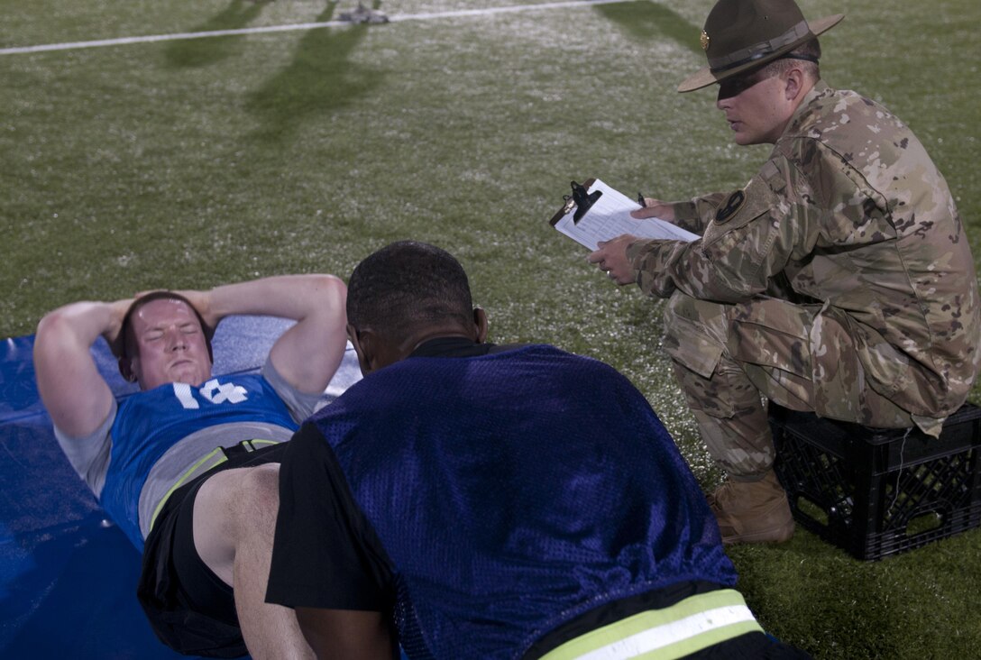 A Warrior is graded during the sit-up event as part of the Army Physical Fitness Test at the 2017 U.S. Army Reserve Best Warrior Competition at Fort Bragg, N.C. June 12, 2017. This year’s Best Warrior Competition will determine the top noncommissioned officer and junior enlisted Soldier who will represent the U.S. Army Reserve in the Department of the Army Best Warrior Competition later this year at Fort A.P. Hill, Va. (U.S. Army Reserve photo by Sgt. Jennifer Shick) (Released)
