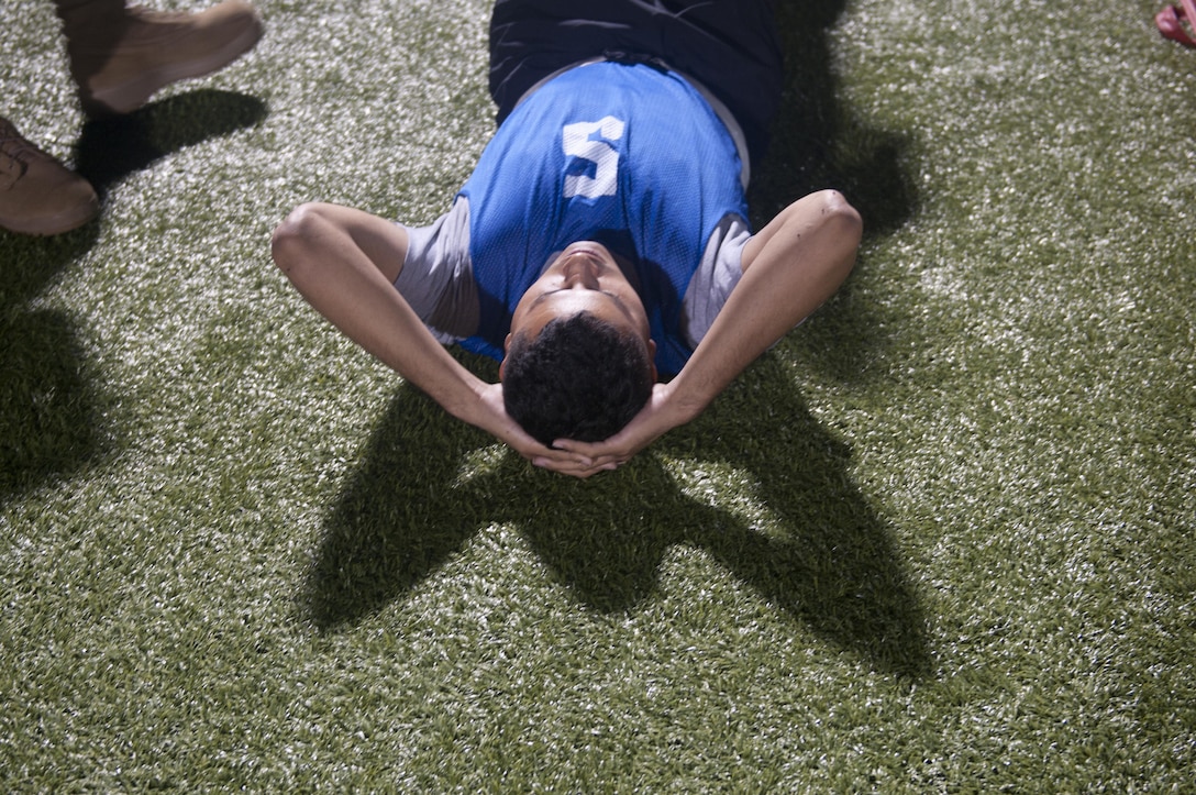 A Warrior is graded during the sit-up event as part of the Army Physical Fitness Test at the 2017 U.S. Army Reserve Best Warrior Competition at Fort Bragg, N.C. June 12, 2017. This year’s Best Warrior Competition will determine the top noncommissioned officer and junior enlisted Soldier who will represent the U.S. Army Reserve in the Department of the Army Best Warrior Competition later this year at Fort A.P. Hill, Va. (U.S. Army Reserve photo by Sgt. Jennifer Shick) (Released)