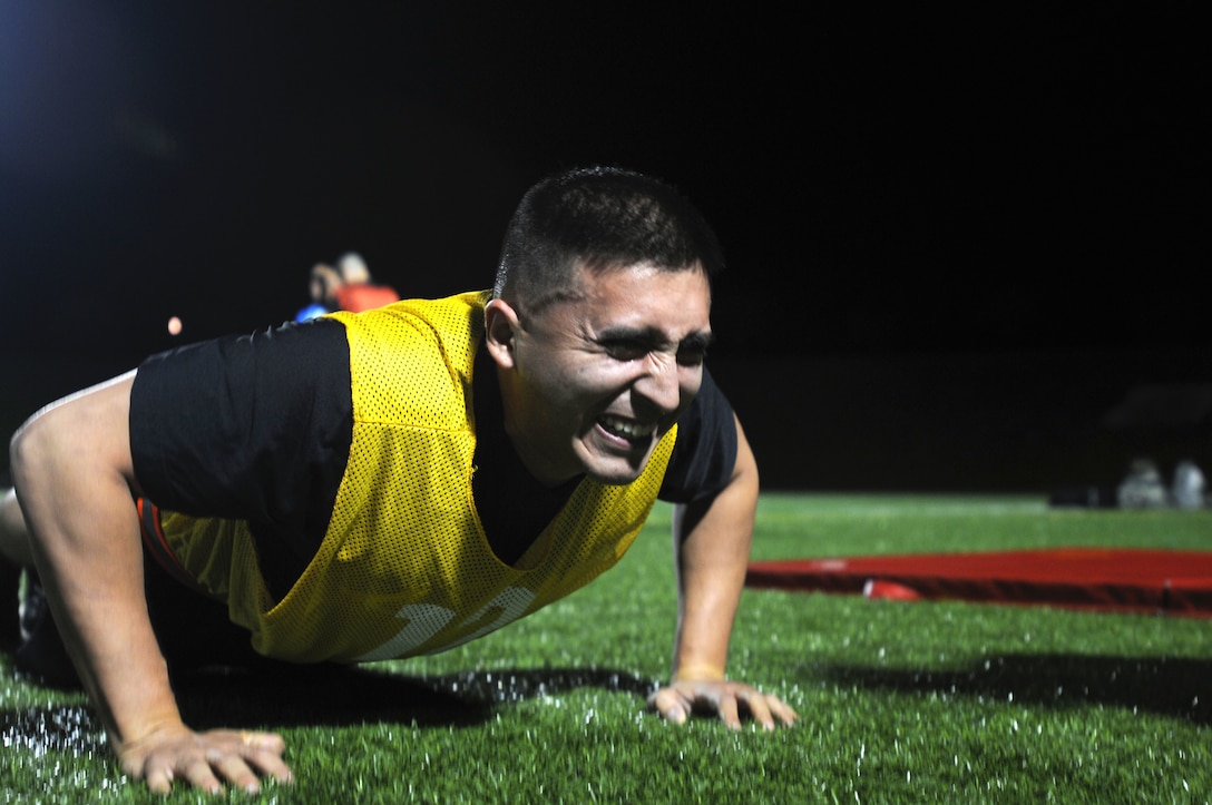 Sgt. Ruben Chagolla is graded during the push-up event as part of the Army Physical Fitness Test at the 2017 U.S. Army Reserve Best Warrior Competition at Fort Bragg, N.C. June 12, 2017. This year’s Best Warrior Competition will determine the top noncommissioned officer and junior enlisted Soldier who will represent the U.S. Army Reserve in the Department of the Army Best Warrior Competition later this year at Fort A.P. Hill, Va. (U.S. Army Reserve photo by Sgt. Jennifer Shick) (Released)